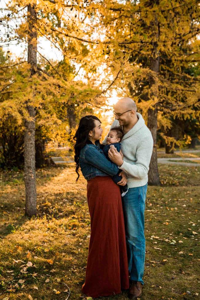 Natural looking family photo - a family at Nose Hill Park during golden hour - Learning Photography