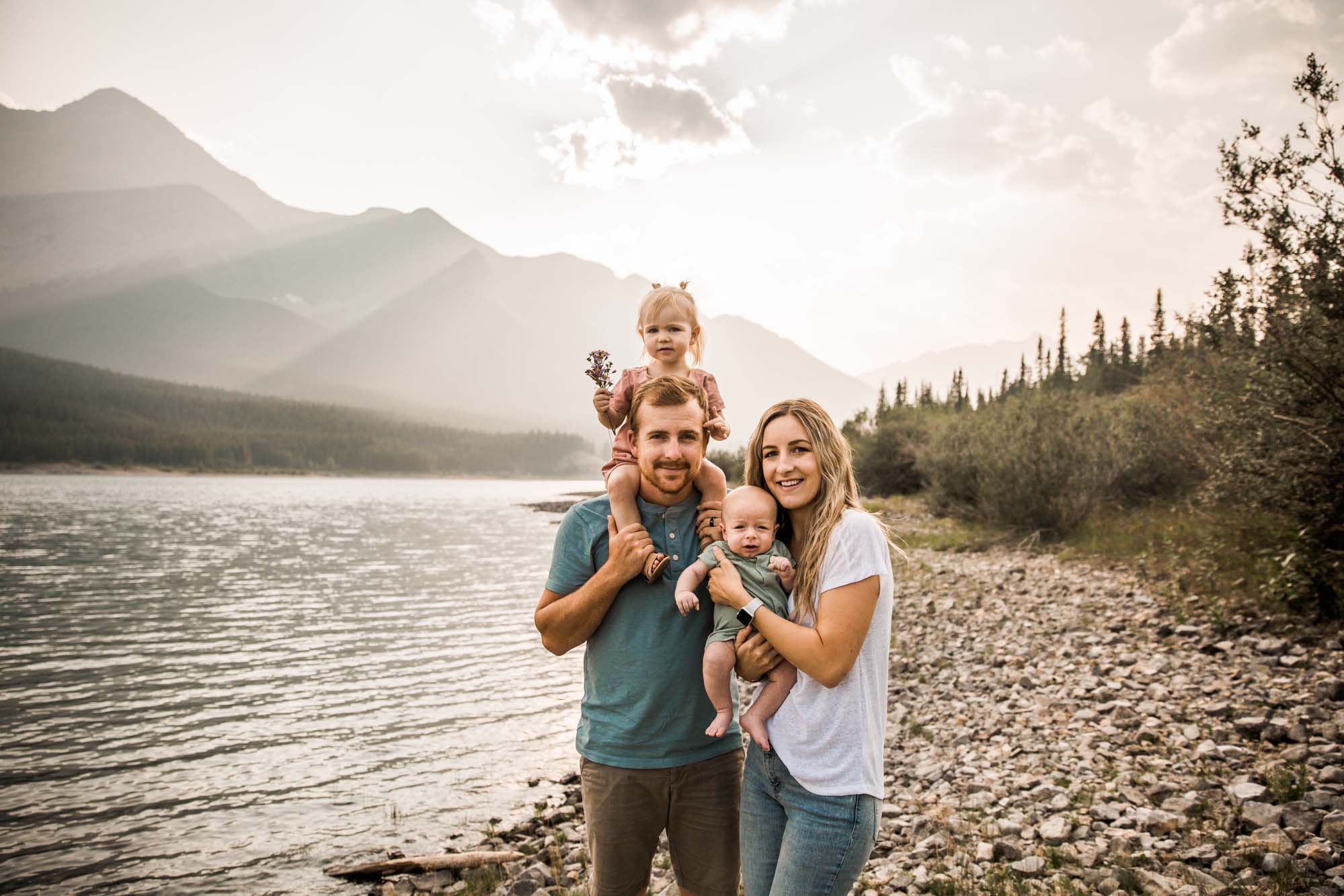 Calgary lifestyle family photographer, family photos by the water and mountains at sunset in Kananaskis Country