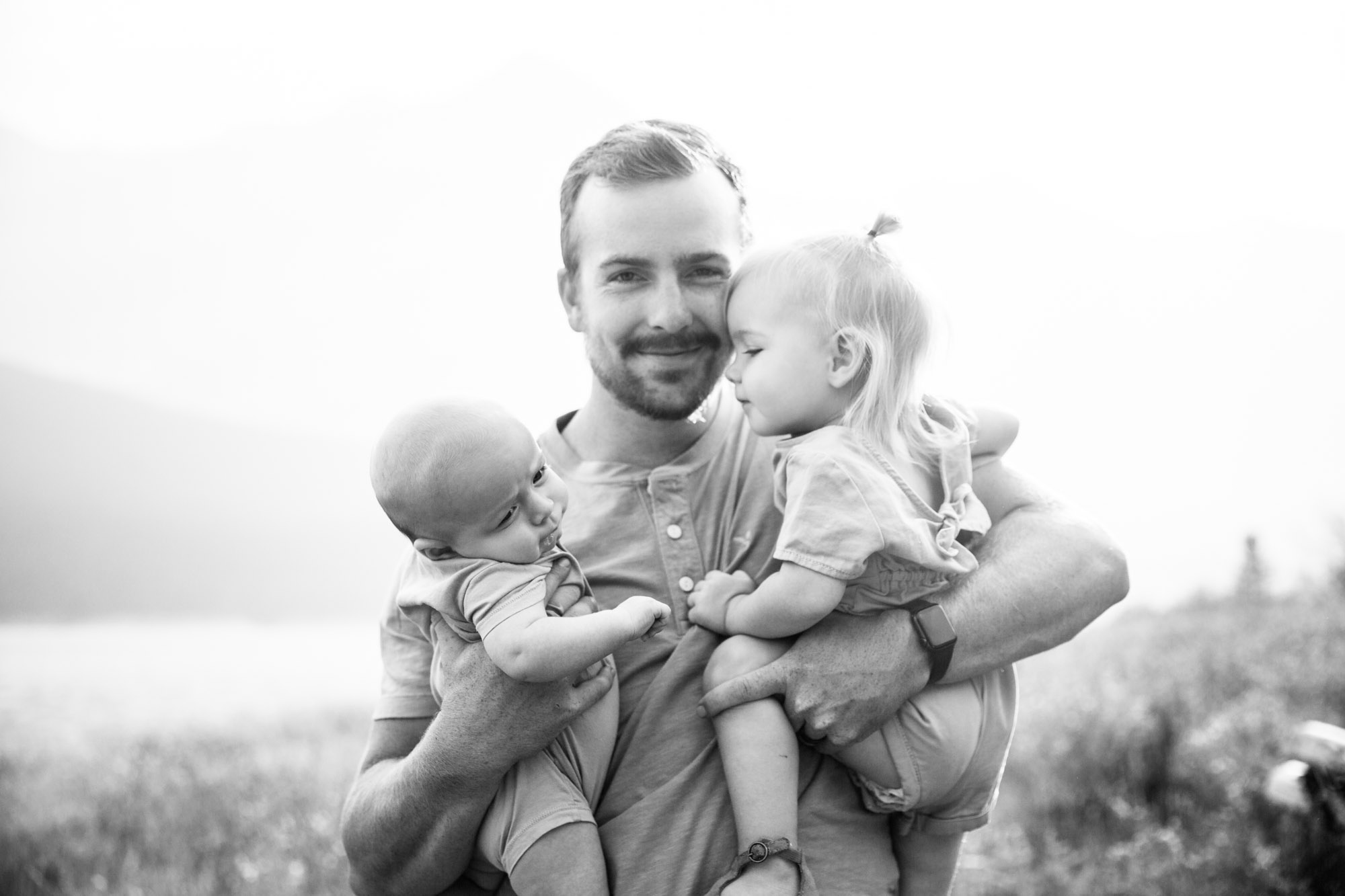 Calgary and Kananaskis Country mountains family photographer, a family photo surrounded by mountains
