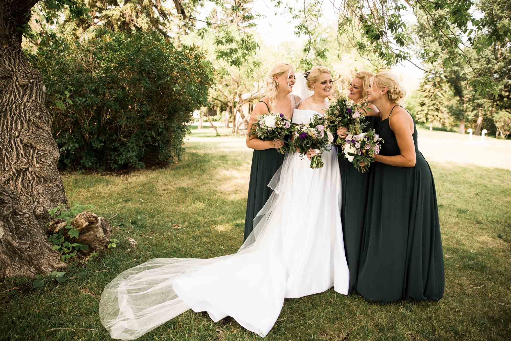 Calgary wedding photographer, portrait of the bridal party at Fish Creek Park
