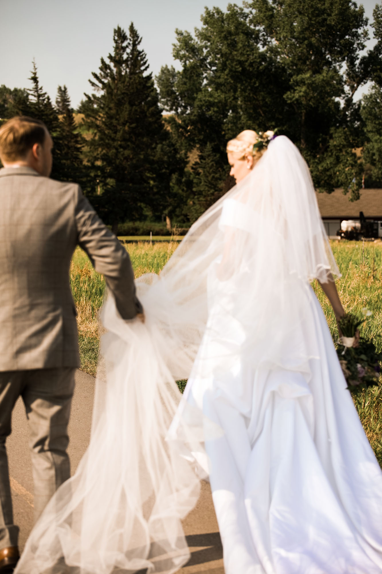 Calgary wedding photographer, portrait of the bride and groom at Fish Creek Park