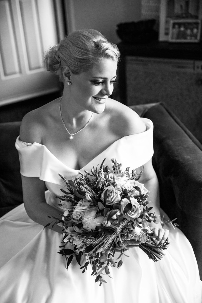 Calgary wedding photographer, the bride and groom getting ready for their wedding ceremony