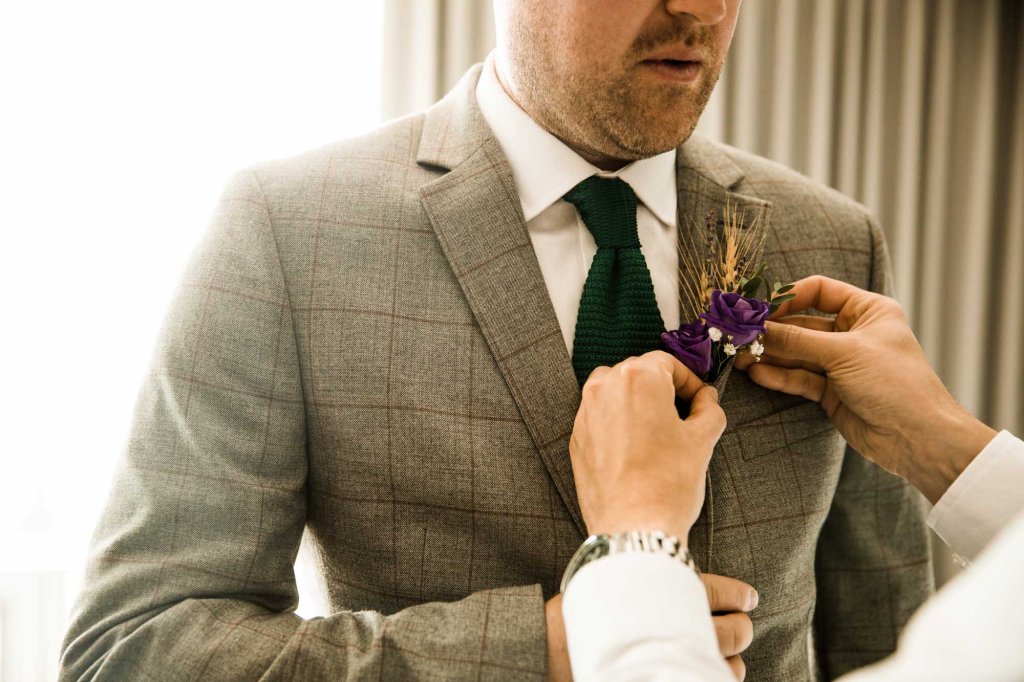 Calgary wedding photographer, the bride and groom getting ready for their wedding ceremony