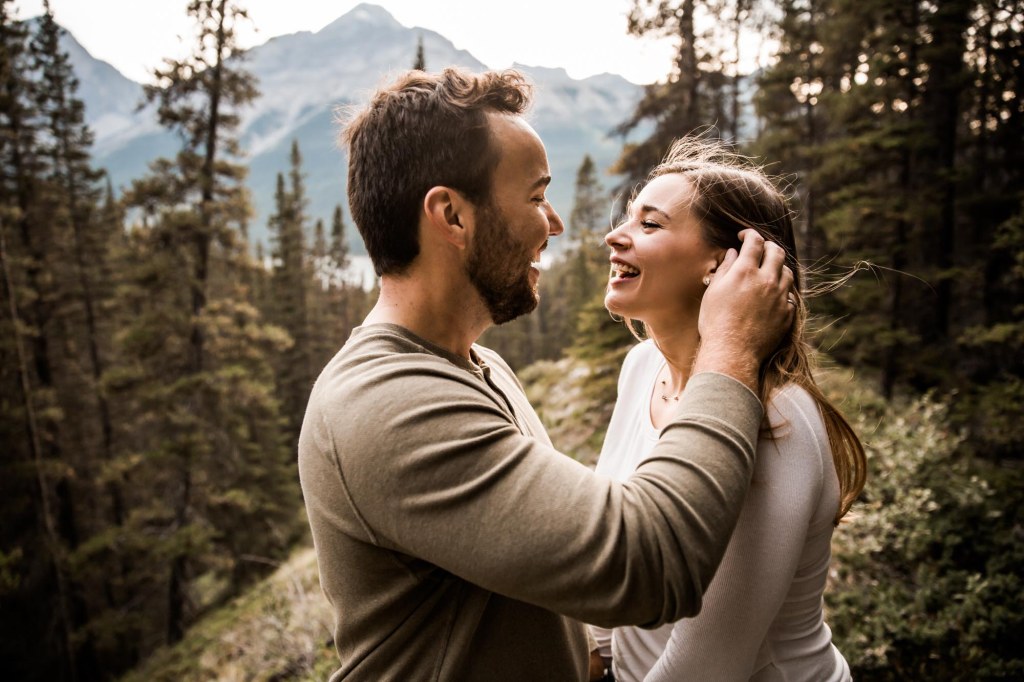 Calgary wedding and engagement photographer, couple in the mountains for adventure engement photos in Kananaskis Country