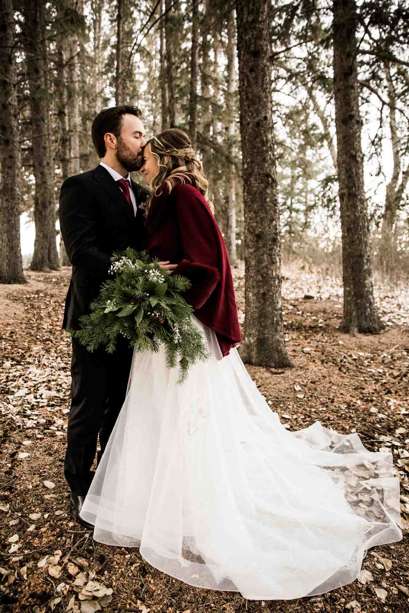 Alberta wedding photographer, wedding at the MVE The Heritage Centre in Cremona, bride and groom during their winter barn wedding