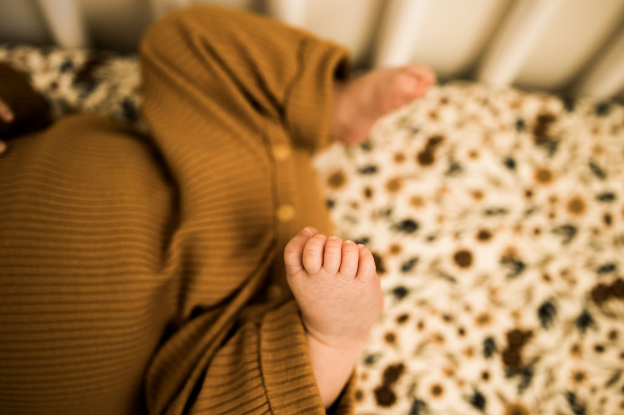 Calgary family photographer, in-home lifestyle newborn photography, baby with mom and dad