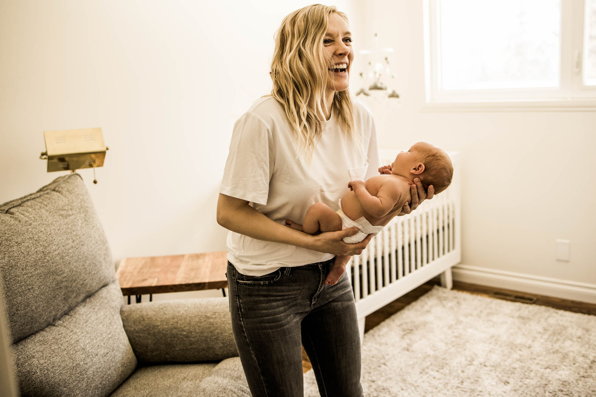 Calgary family photographer, in-home lifestyle newborn photography, baby with mom and dad