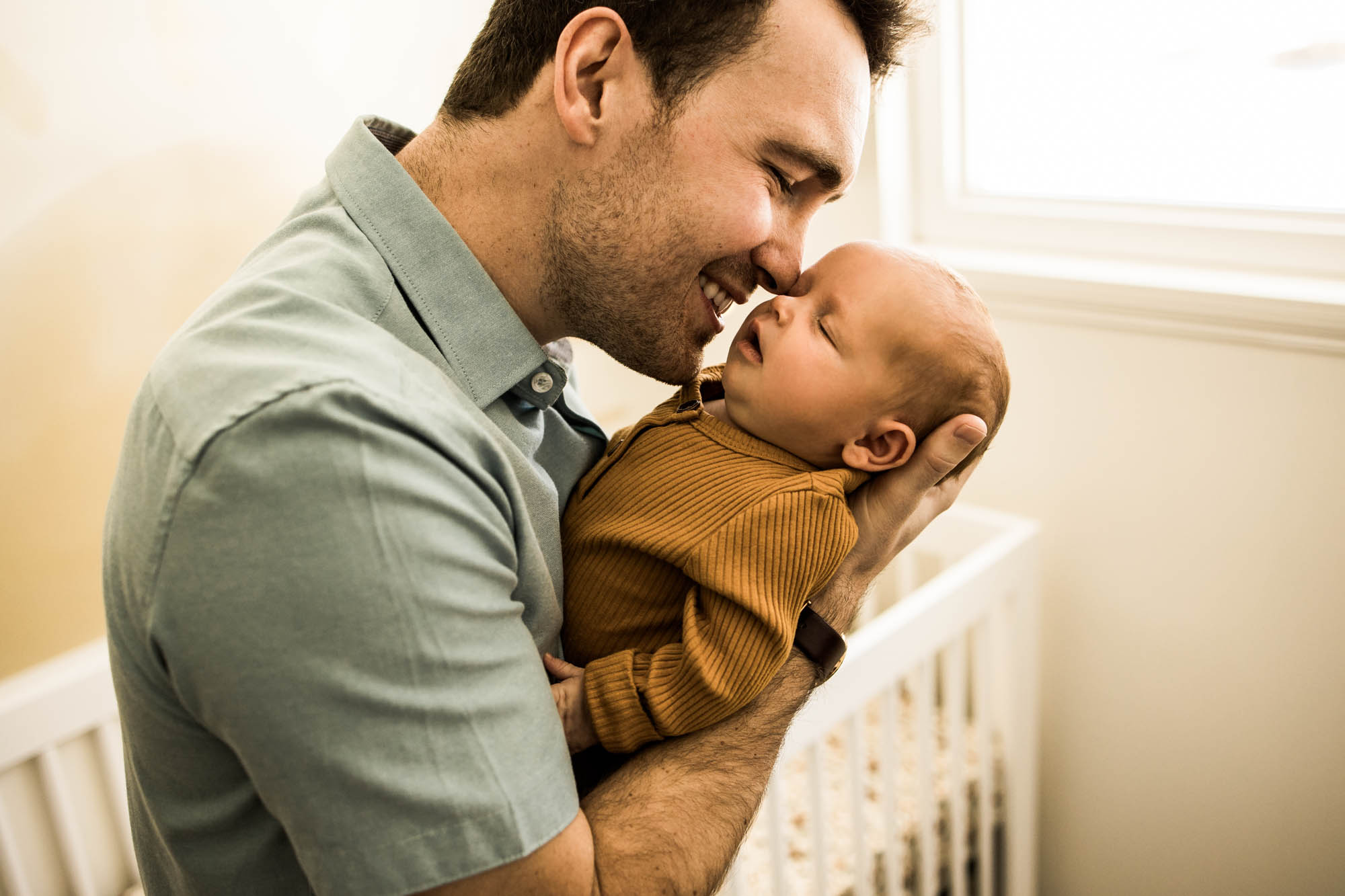 Calgary family photographer, in-home lifestyle newborn photography, baby with mom and dad