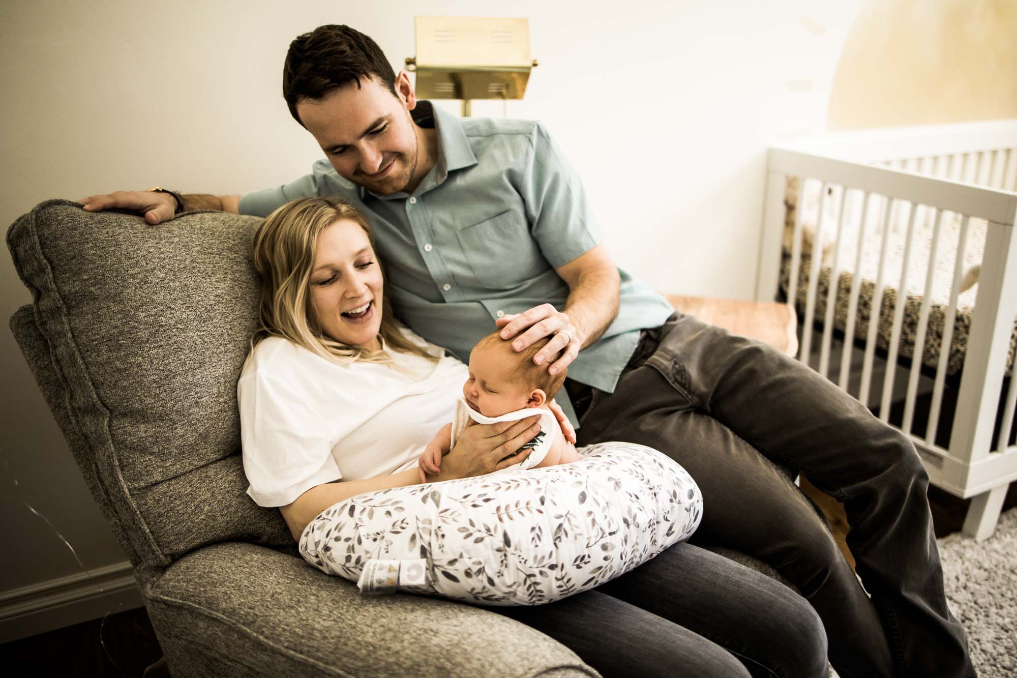Calgary family photographer, in-home lifestyle newborn photography, baby with mom and dad