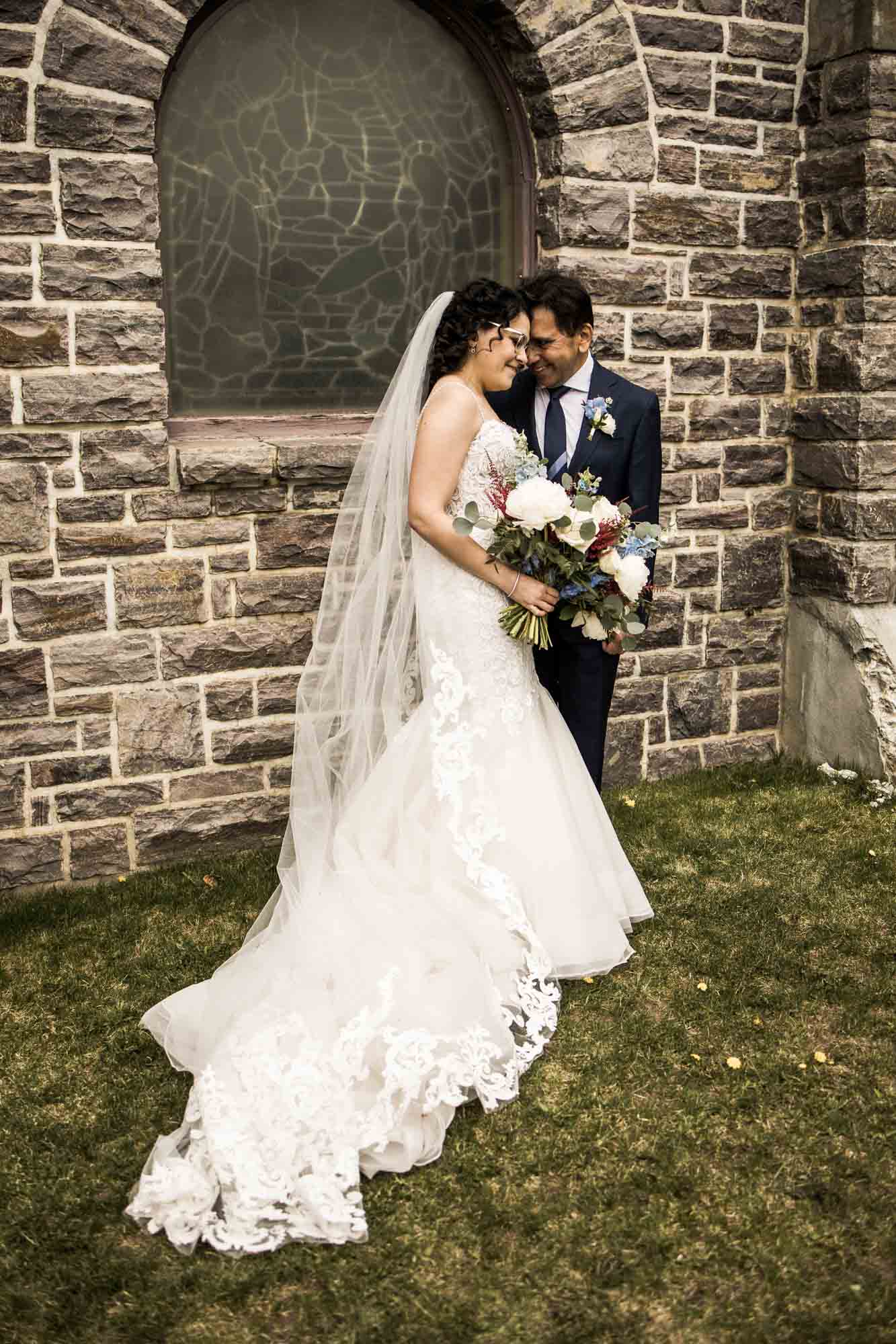 Banff wedding photographer, a couple on their wedding day at the Rimrock, St Mary's Parish in Banff National Park