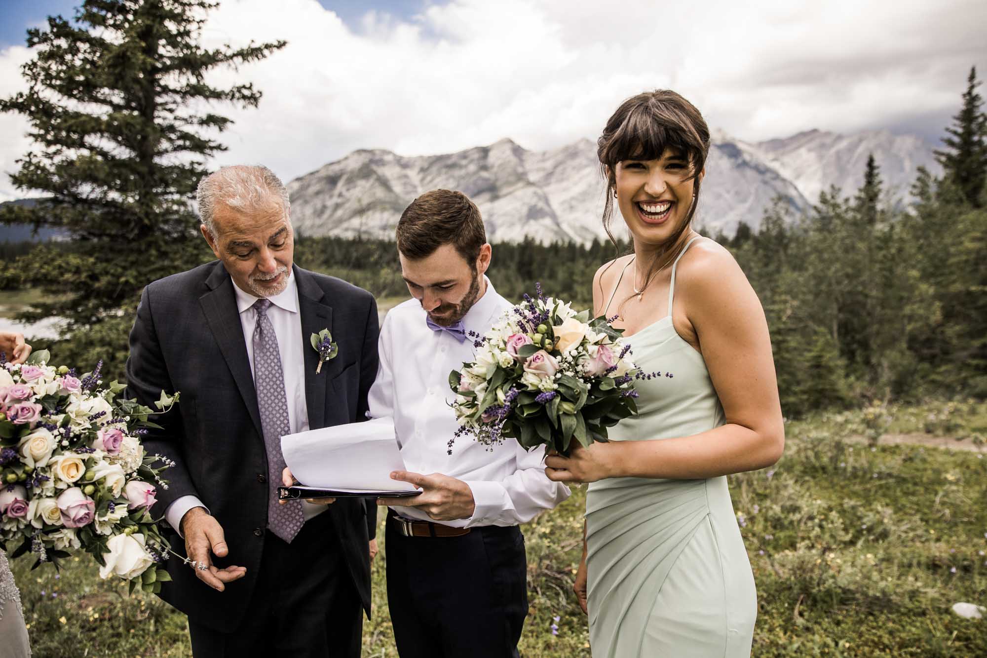 Calgary and Kananaskis Country wedding photographer, bride and groom for elopement photos in Kananaskis Country in front of water and mountains