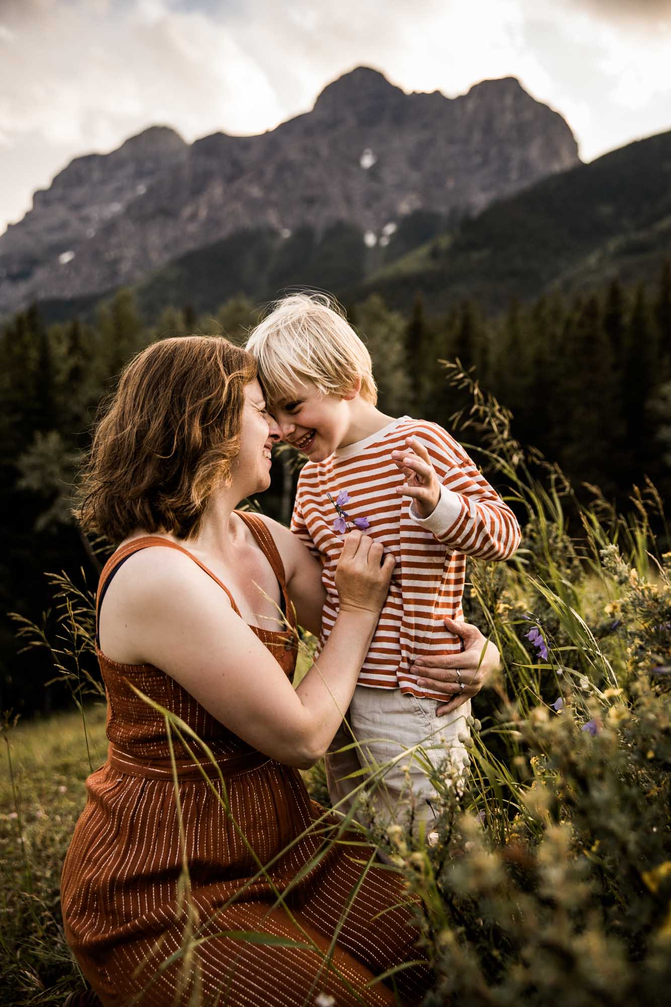 Calgary, Kananaskis, Banff lifestyle family photographer, family in the mountains in Kananaskis Country in a field with wild flowers at sunset