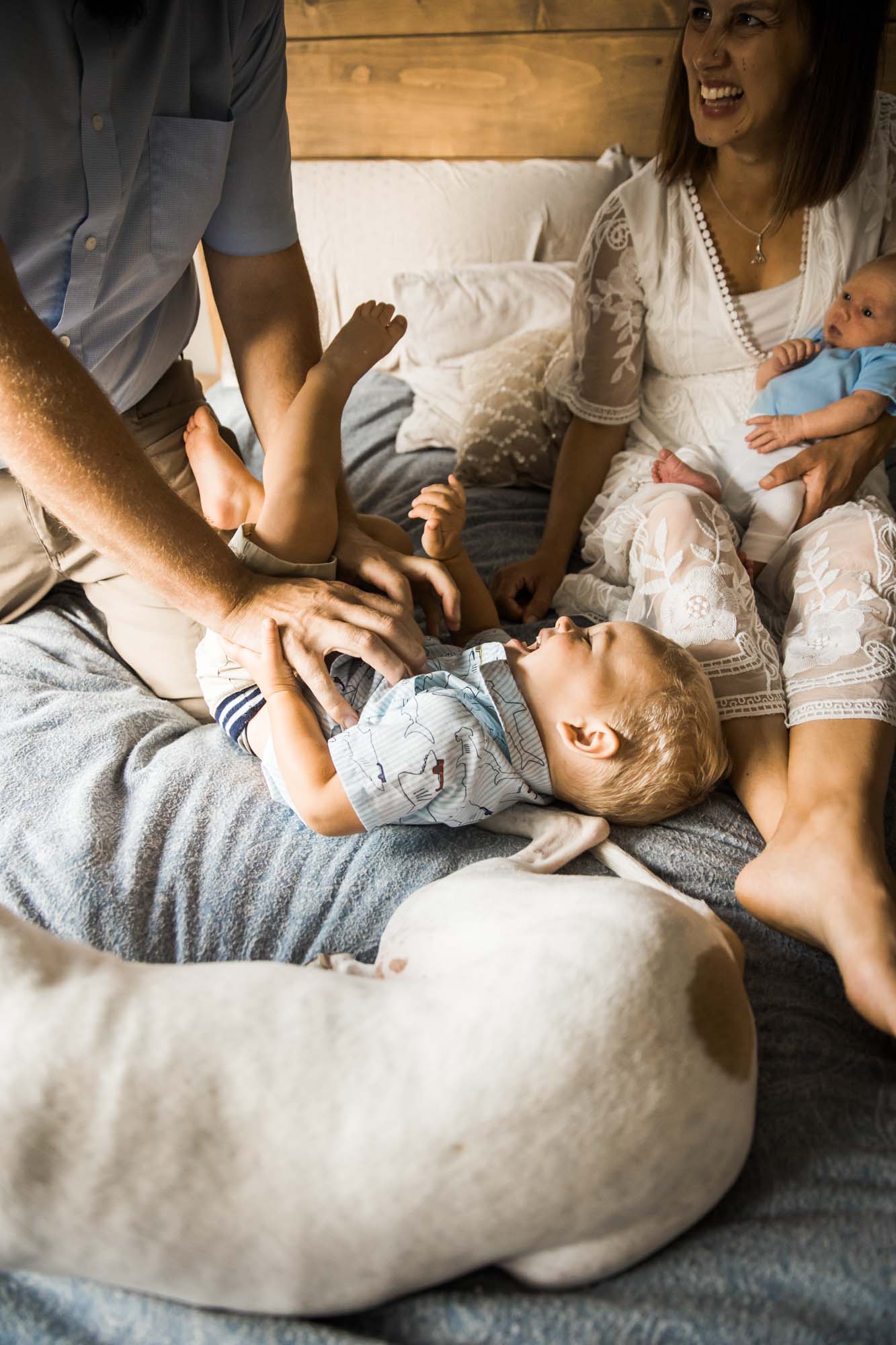 Calgary in-home lifestyle newborn photo of a newborn baby with family