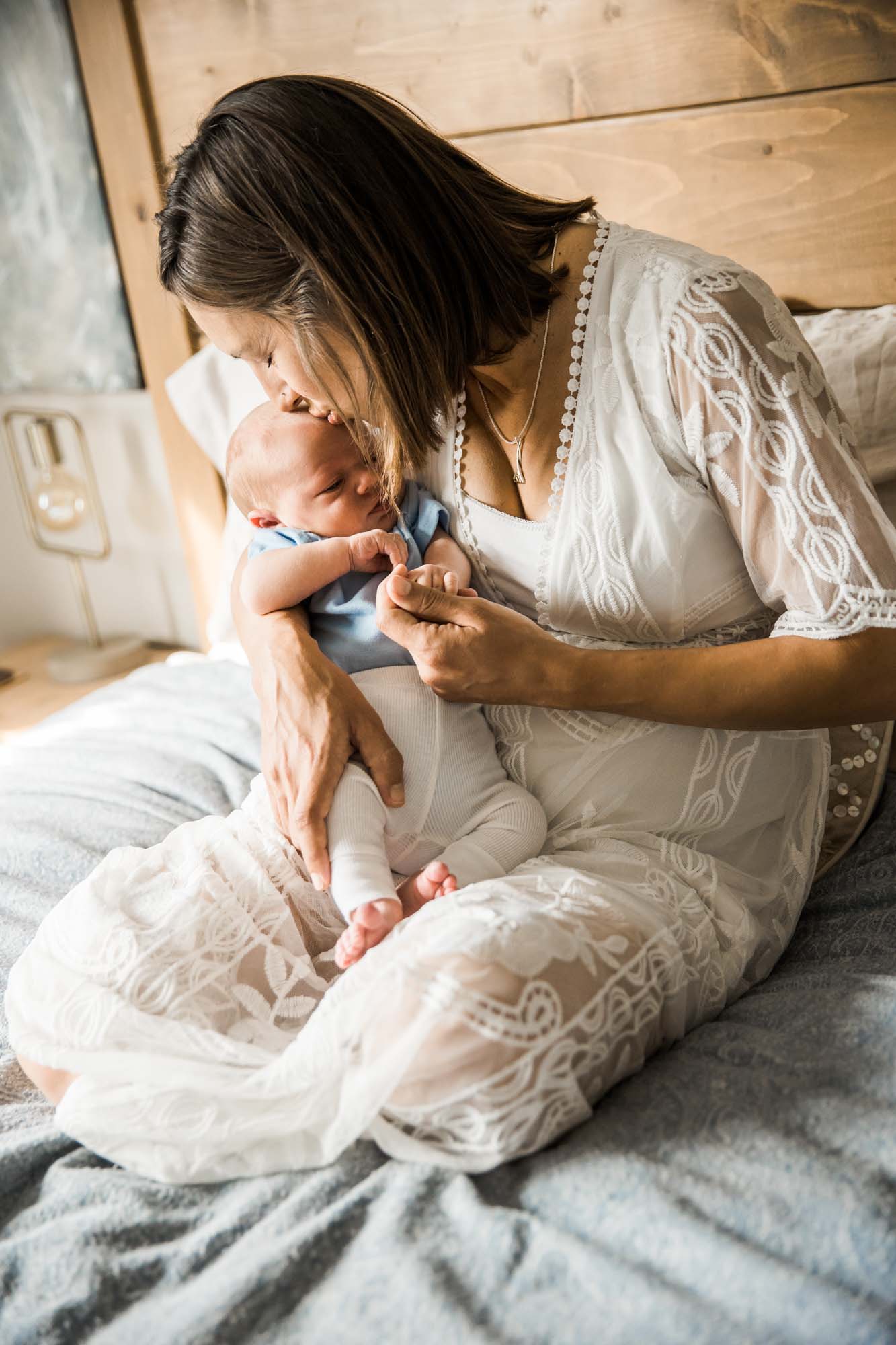Calgary in-home lifestyle newborn photo of a newborn baby with family