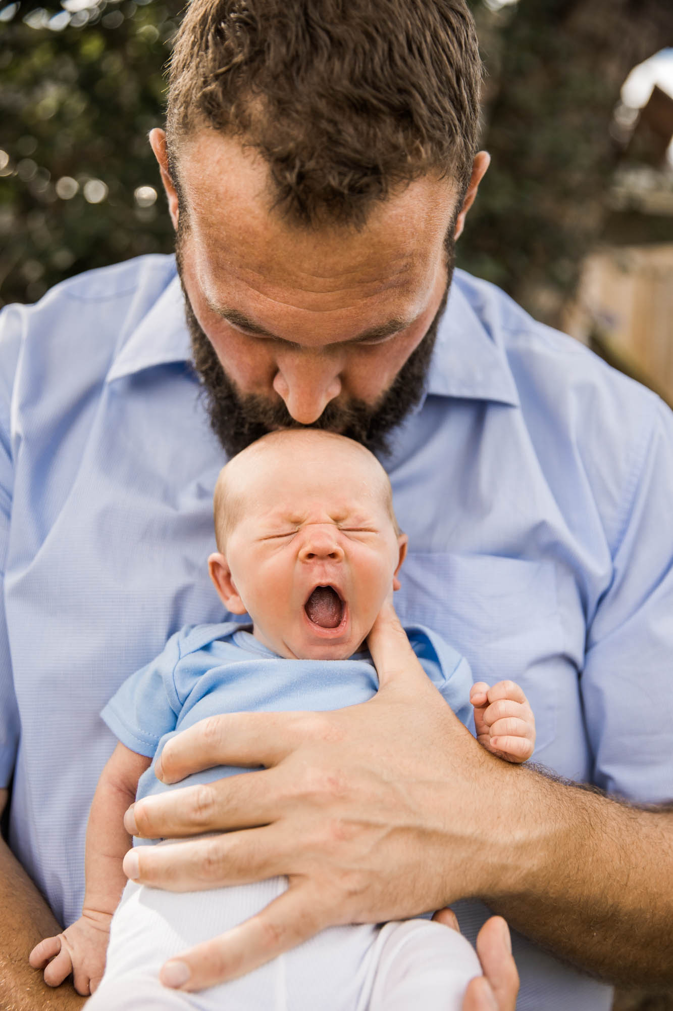 Calgary in-home lifestyle newborn photo of a newborn baby with family