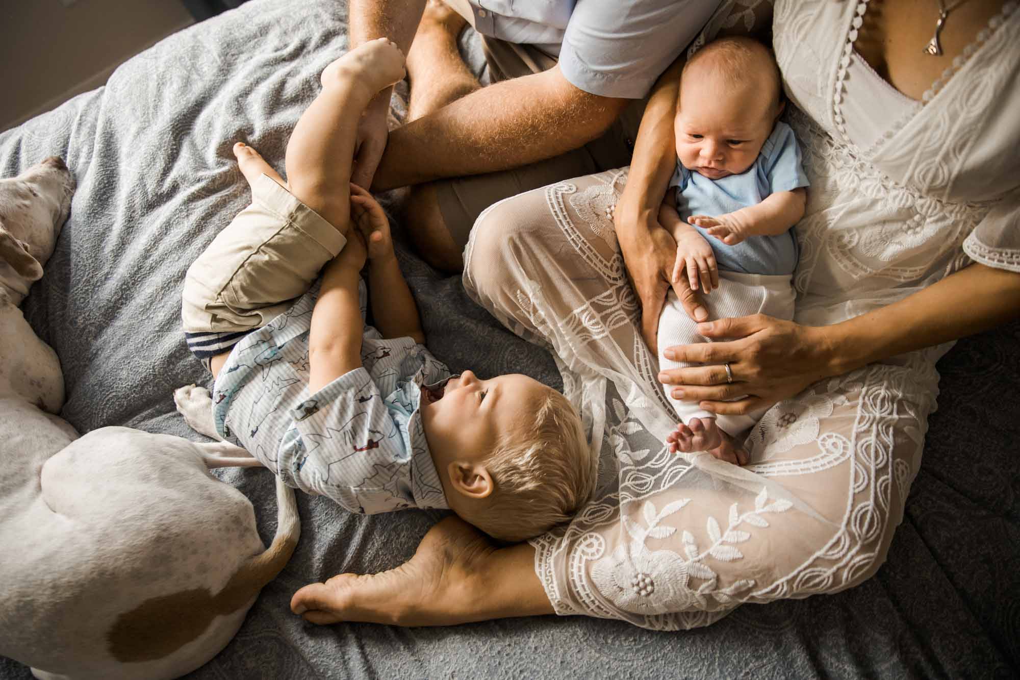 Calgary in-home lifestyle newborn photo of a newborn baby with family