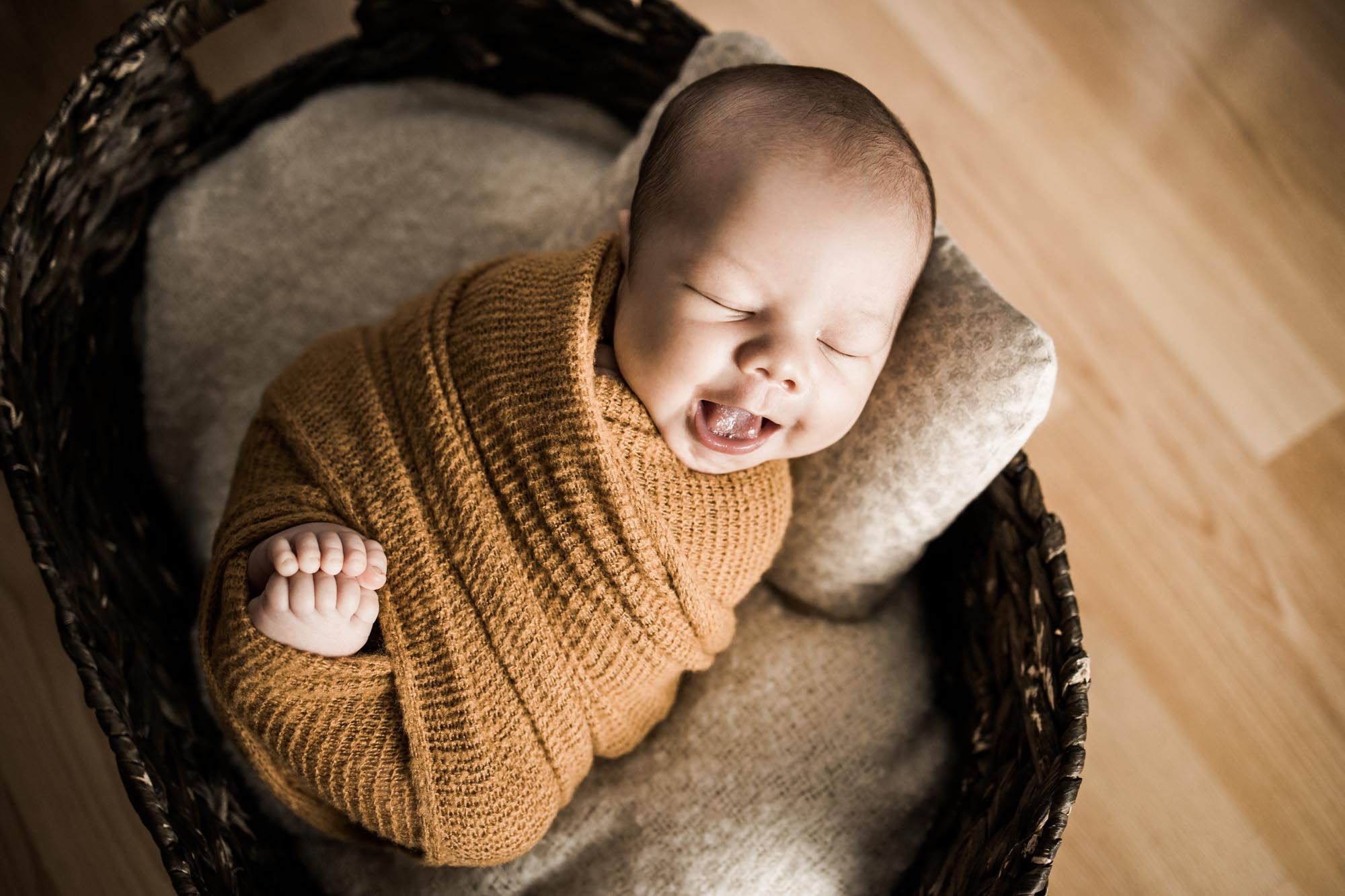 Calgary lifestyle newborn photographer, baby and his parents during his in-home newborn photoshoot