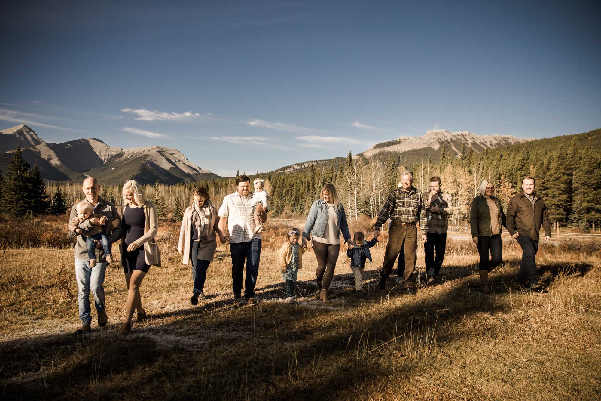 Calgary, Kananaskis, Banff lifestyle family photographer, family in front of the mountains during their fall family photos in Kananaskis Country