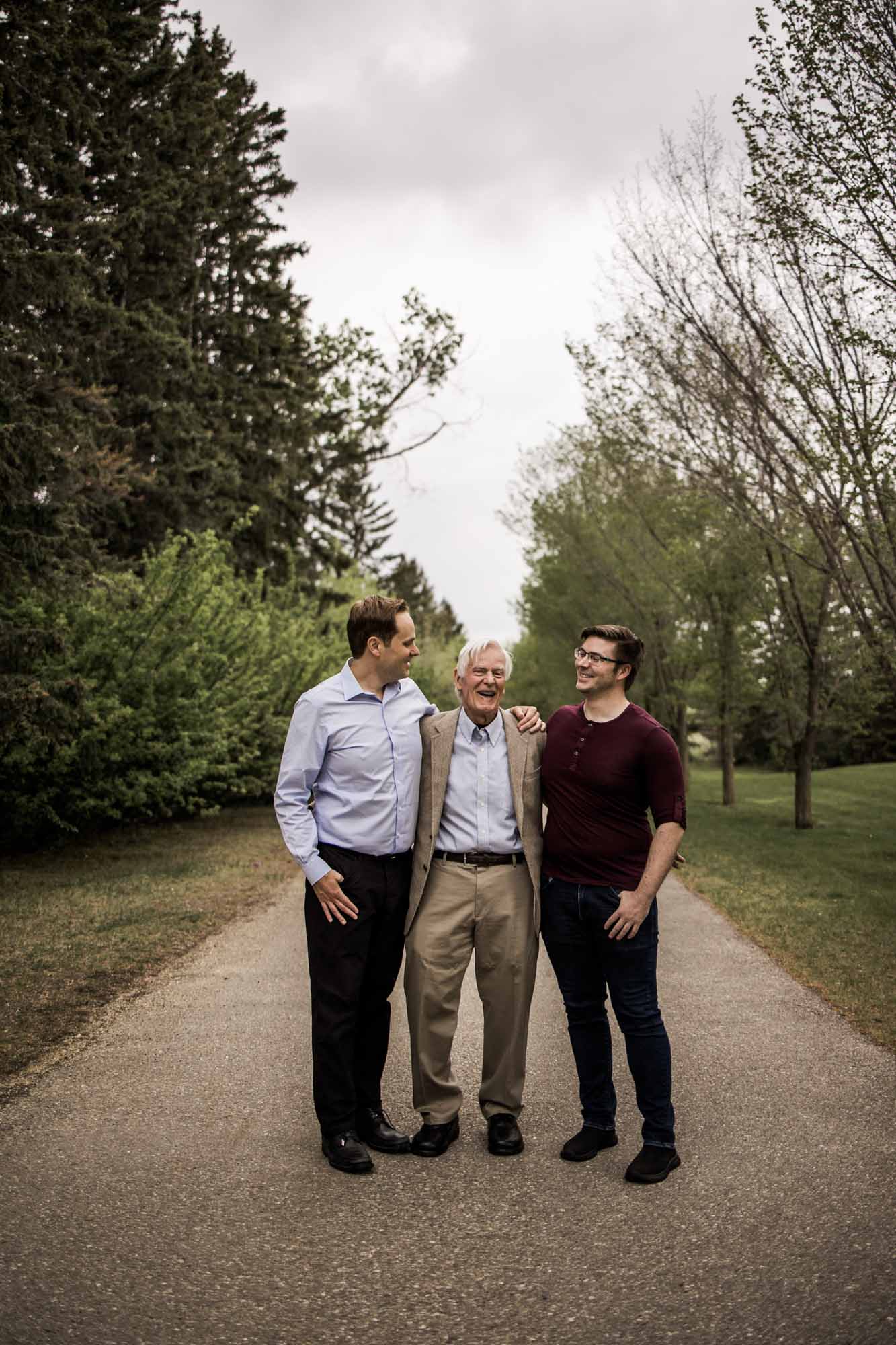 Calgary, Kananaskis, Banff lifestyle family photographer, family in front of flowers during their spring family photos