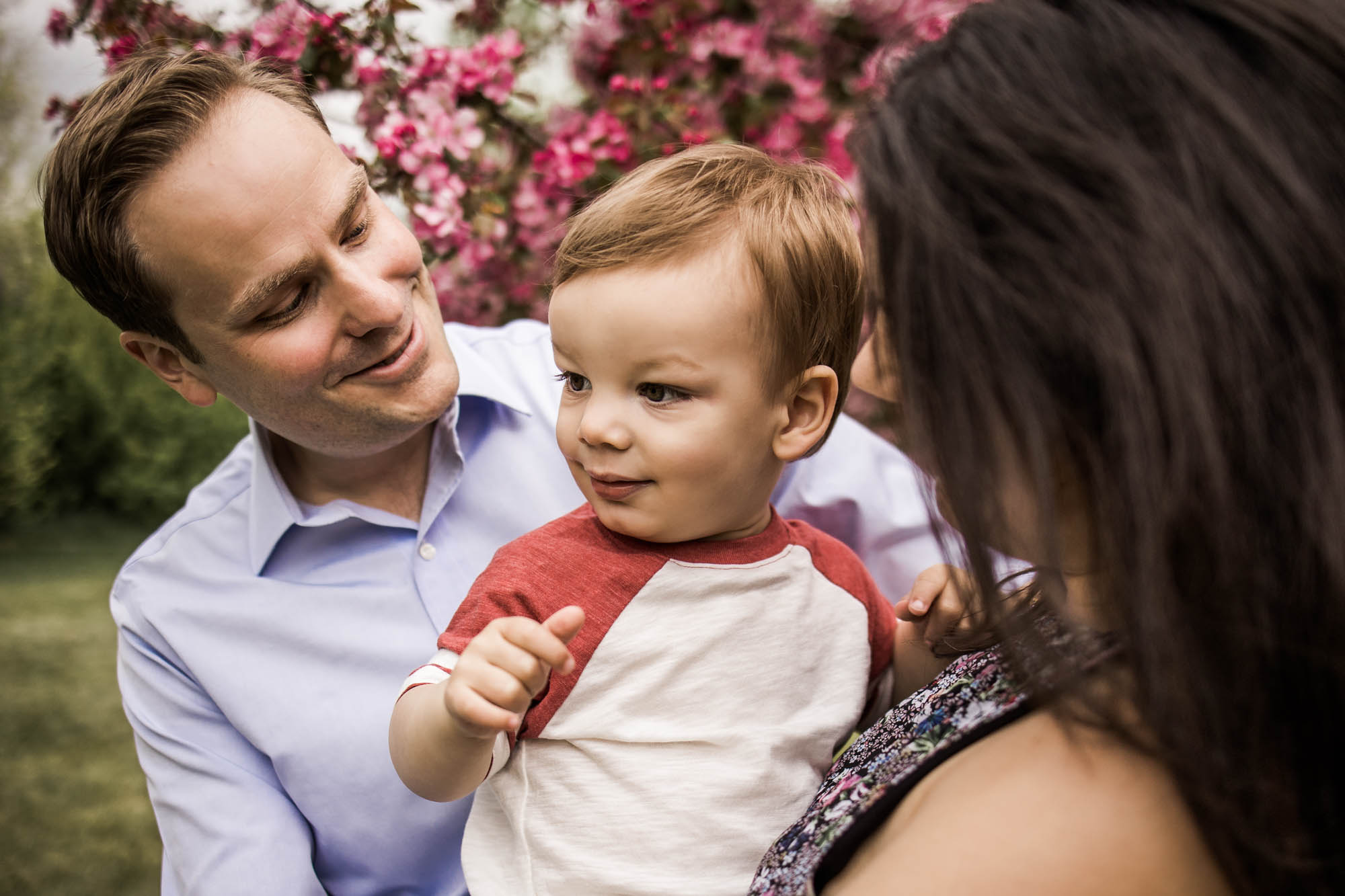 Calgary, Kananaskis, Banff lifestyle family photographer, family in front of flowers during their spring family photos