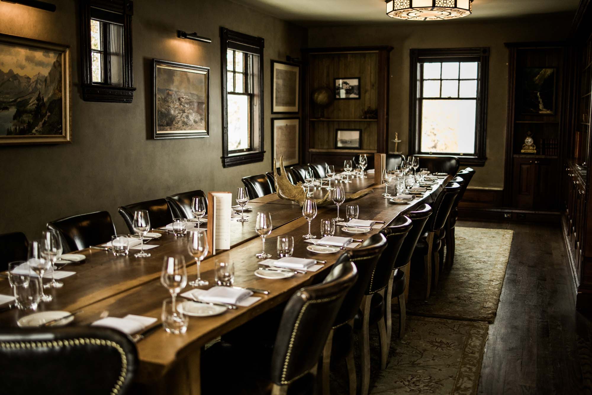 Calgary wedding photographer, bride in her dress with her bridal flowers and groom on their wedding day at Deane House Restaurant, intimate family dinner