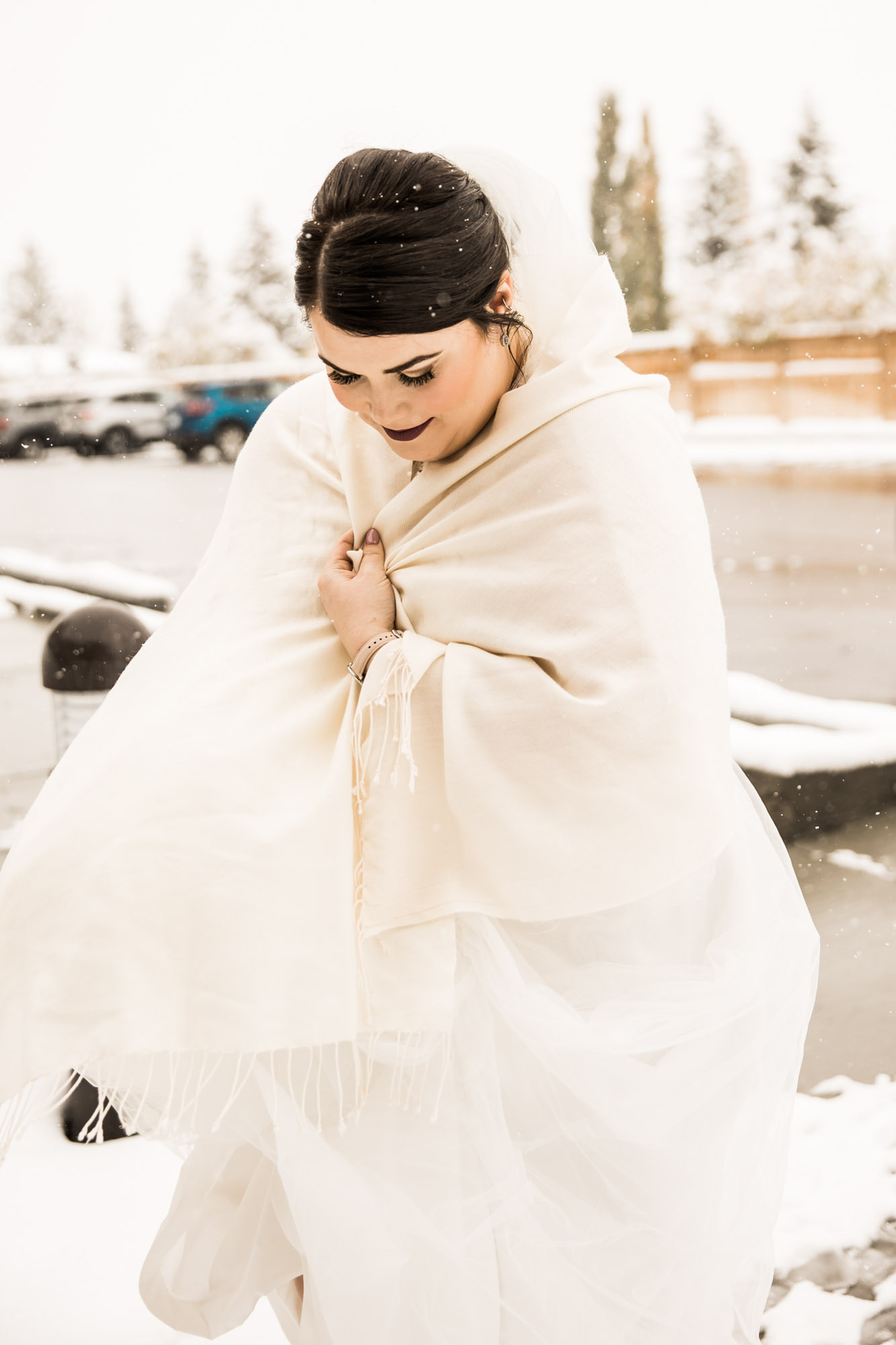 Calgary wedding photographer, bride in her dress with her bridal flowers and groom on their wedding day at St Peter's Church