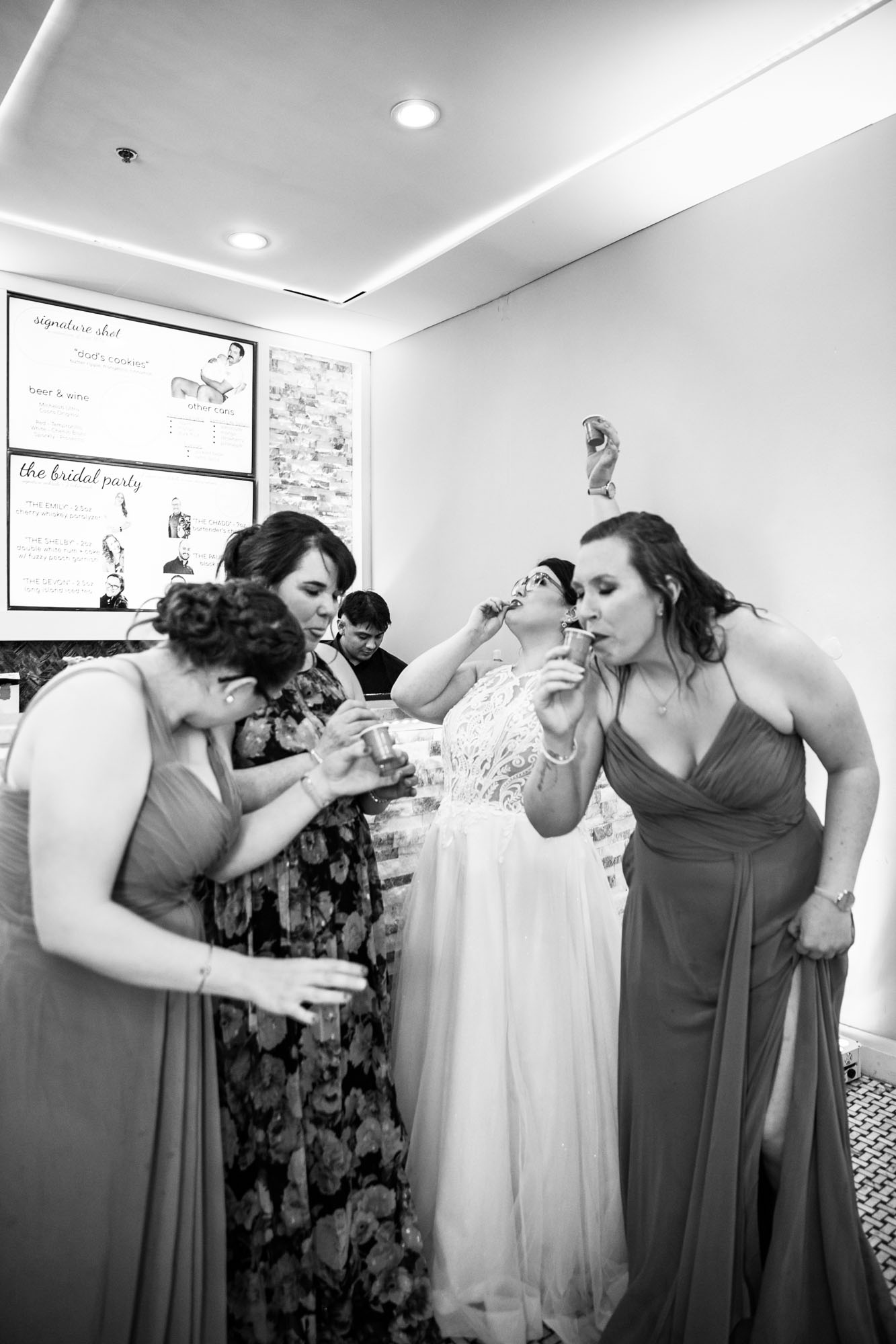Calgary wedding photographer, bride in her dress with her bridal flowers and groom on their wedding day at White Diamond Conference Center, large wedding reception space