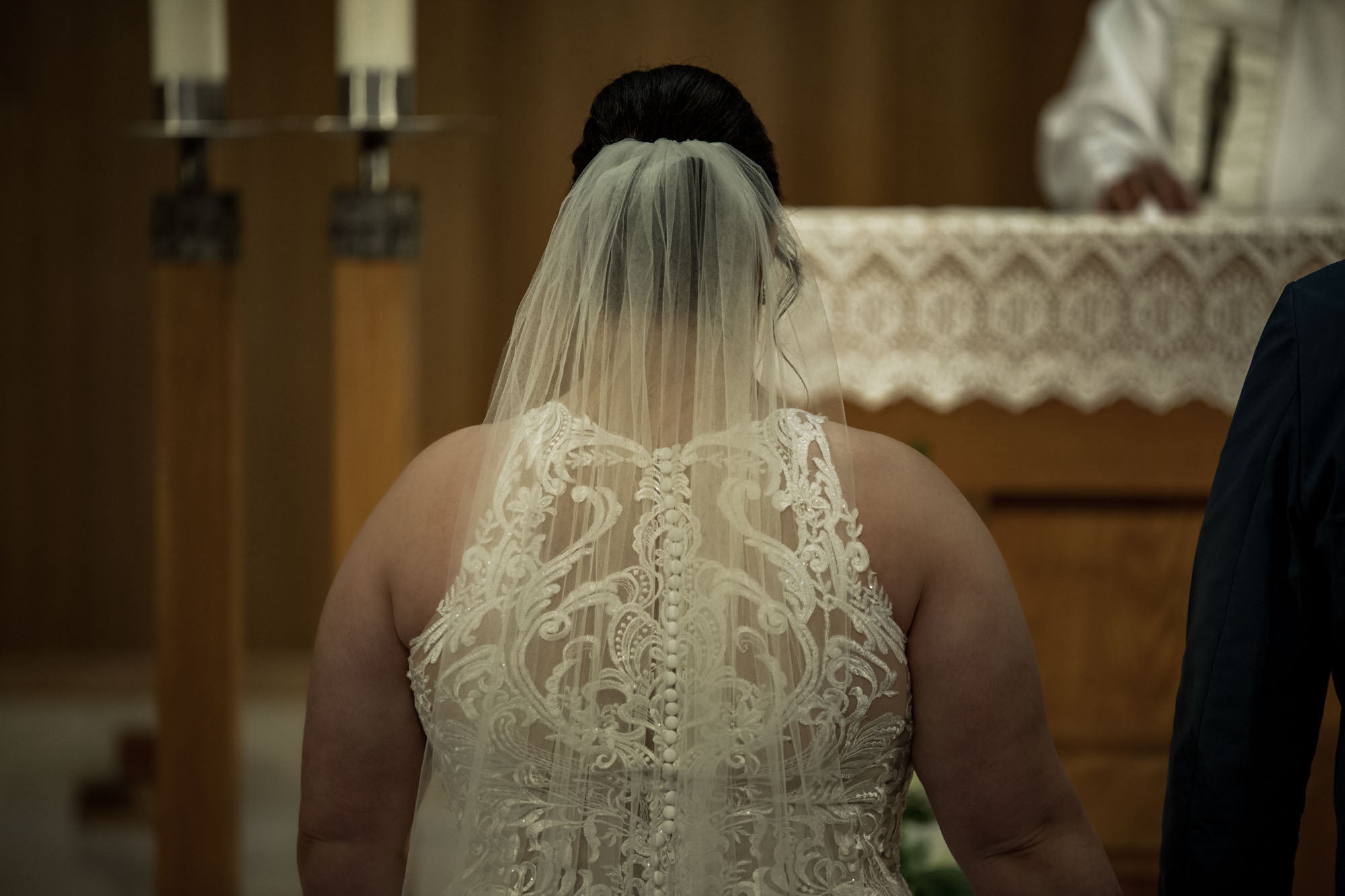 Calgary wedding photographer, bride in her dress with her bridal flowers and groom on their wedding day at St Peter's Church