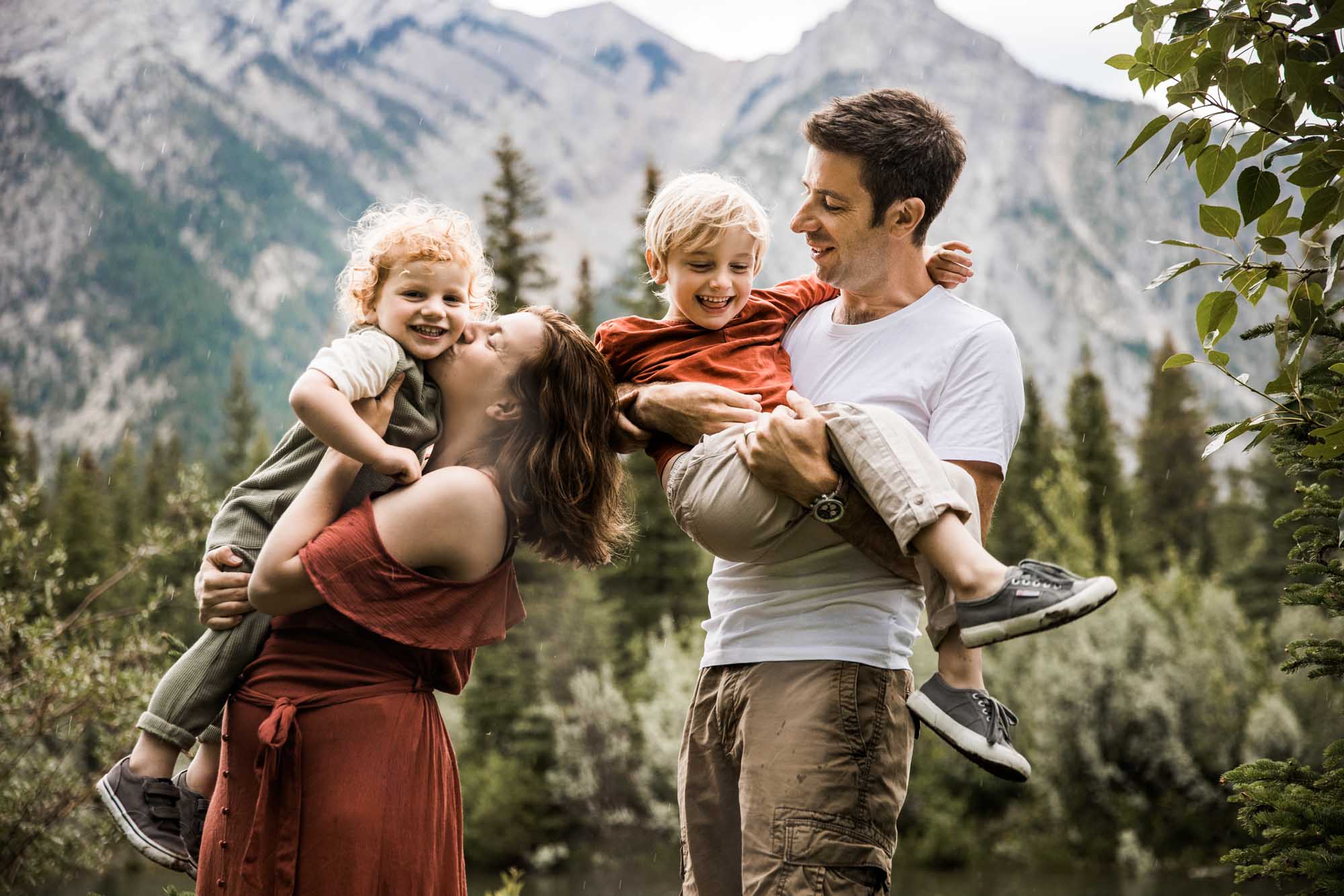 Kananaksis Country, Banff, Canmore family photographer, family photos in the mountains on a hot summer night when the rain started to pour, huge thunderstorm family shoot
