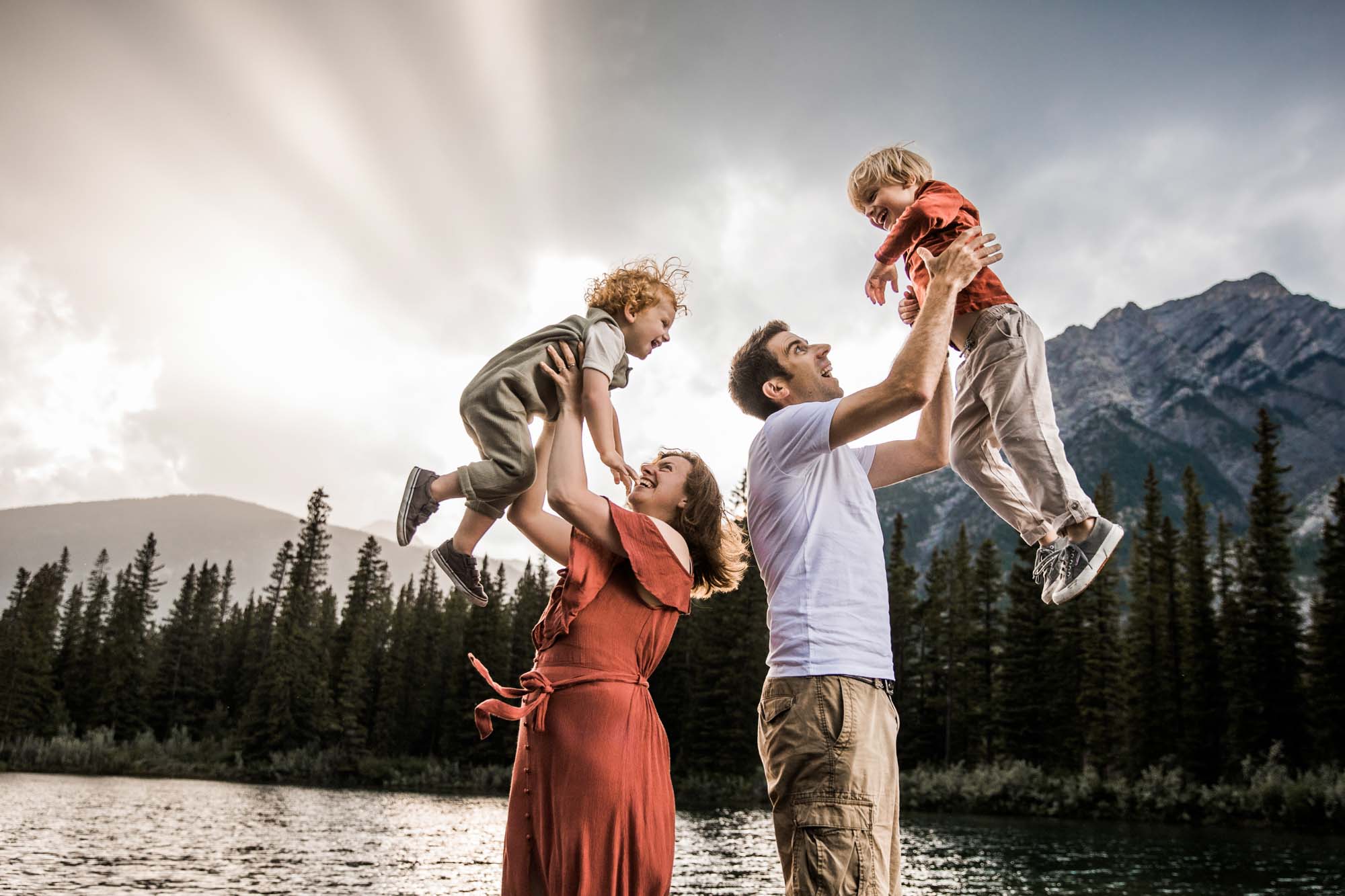 Kananaksis Country, Banff, Canmore family photographer, family photos in the mountains on a hot summer night when the rain started to pour, huge thunderstorm family shoot