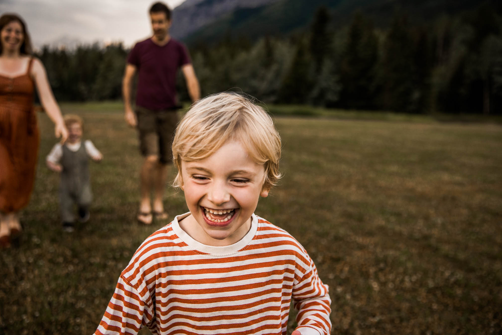 Kananaksis Country, Banff, Canmore family photographer, family photos in the mountains on a hot summer night when the rain started to pour, huge thunderstorm family shoot