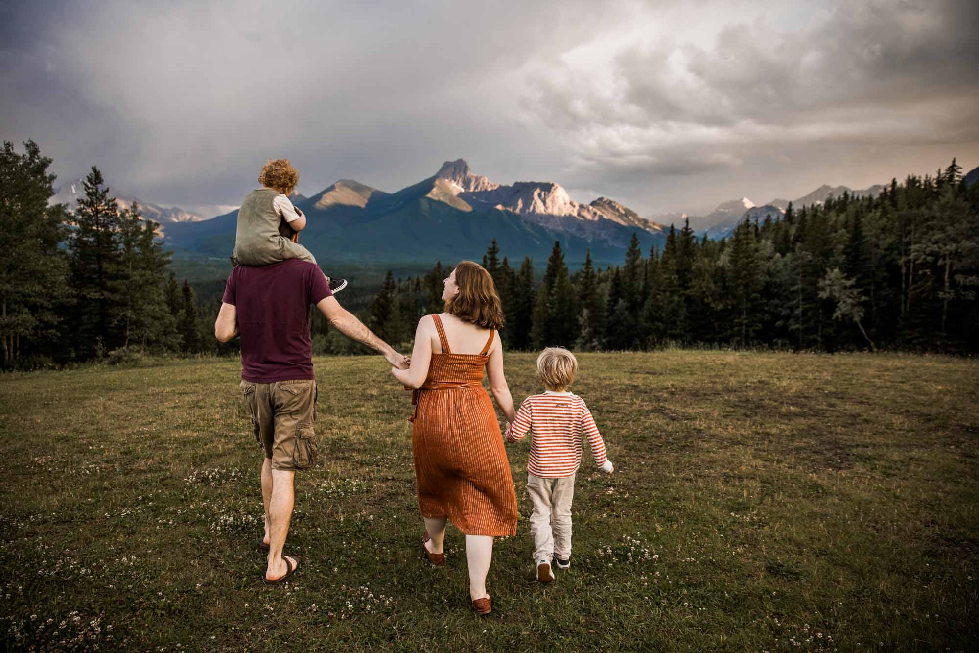 Kananaksis Country, Banff, Canmore family photographer, family photos in the mountains on a hot summer night when the rain started to pour, huge thunderstorm family shoot
