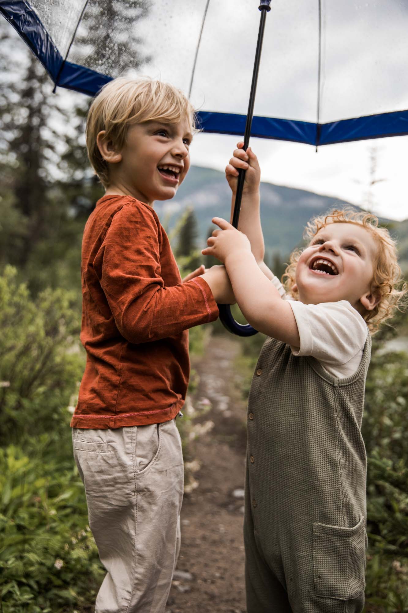 Kananaksis Country, Banff, Canmore family photographer, family photos in the mountains on a hot summer night when the rain started to pour, huge thunderstorm family shoot