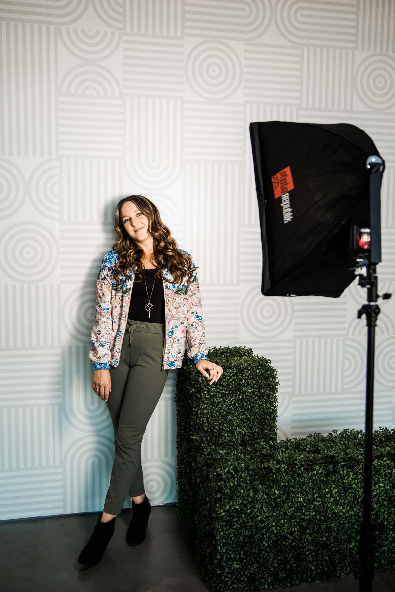 Calgary branding and headshot photographer, copywriter posing for her headshots and branding photos at the Hub at Deerfoot City mall