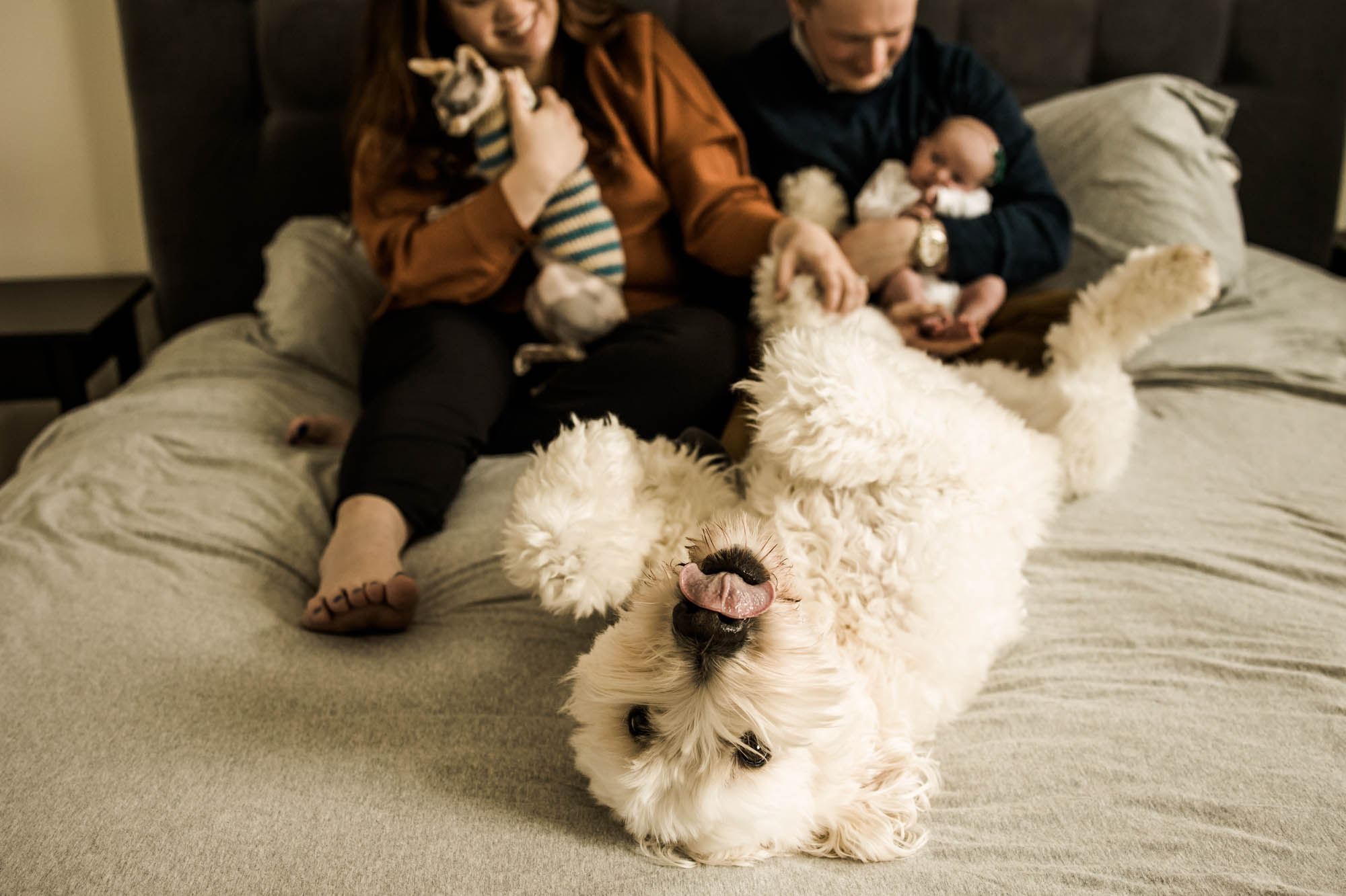 Calgary lifestyle newborn photographer and maternity photographer, baby with her parents during her in-home newborn session
