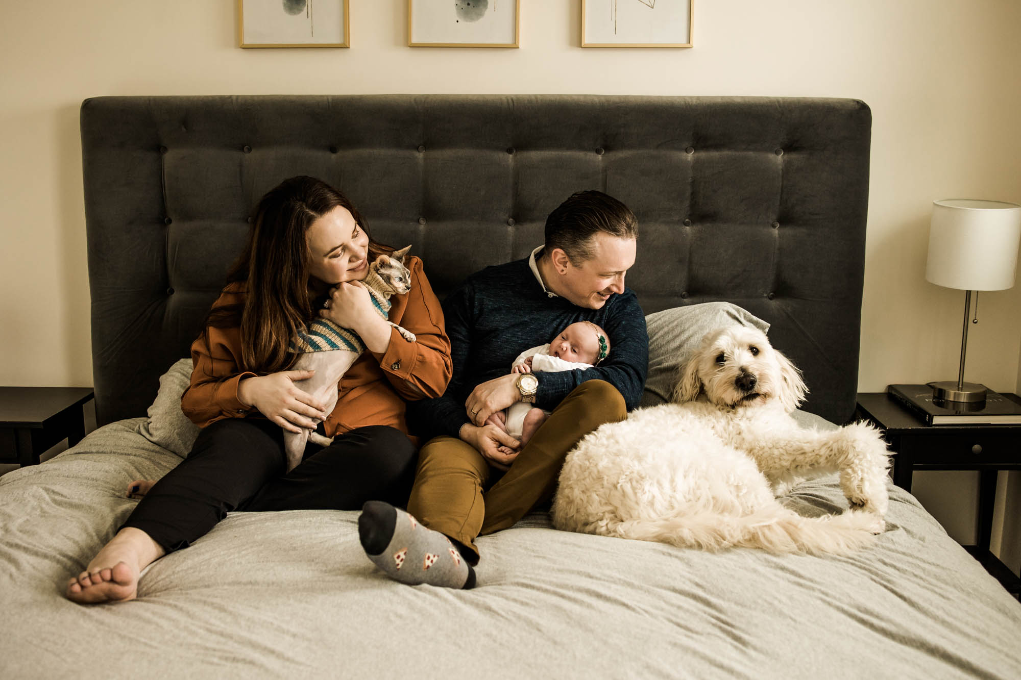 Calgary lifestyle newborn photographer and maternity photographer, baby with her parents during her in-home newborn session