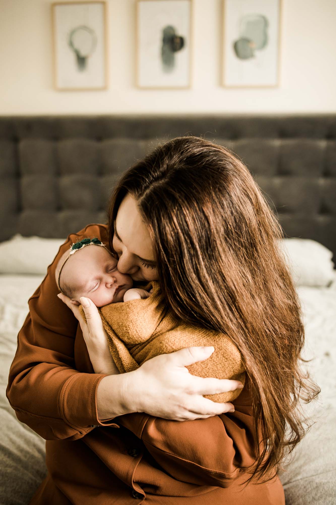 Calgary lifestyle newborn photographer and maternity photographer, baby with her parents during her in-home newborn session
