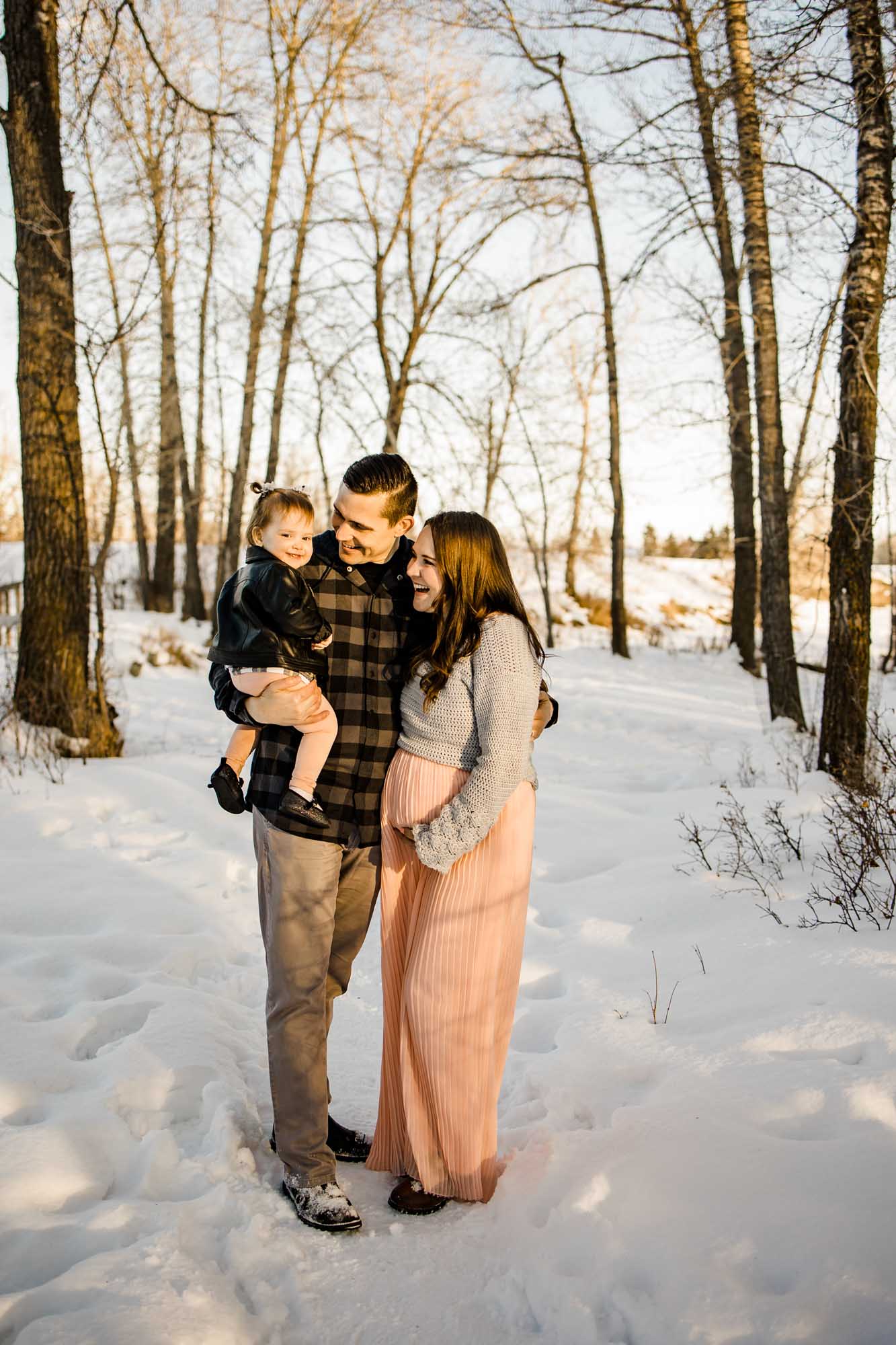 Calgary maternity and newborn photographer, maternity photos with a pregant future mom and toddler daughter at Carburn Park in Calgary