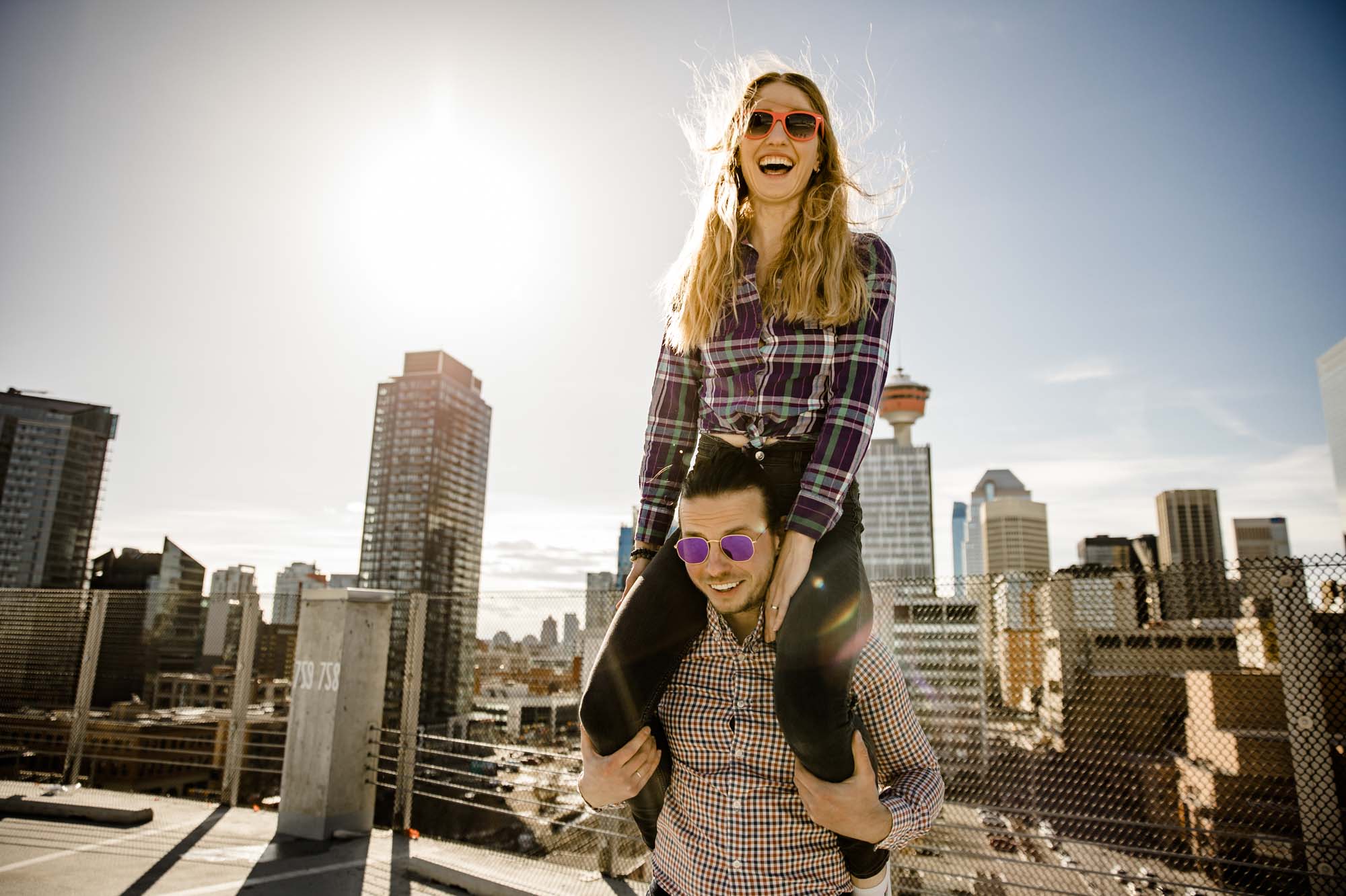 Calgary lifestyle family photograpers, family photo session downtown in the East Village at Platform Innovation Centre in front of the Calgary tower