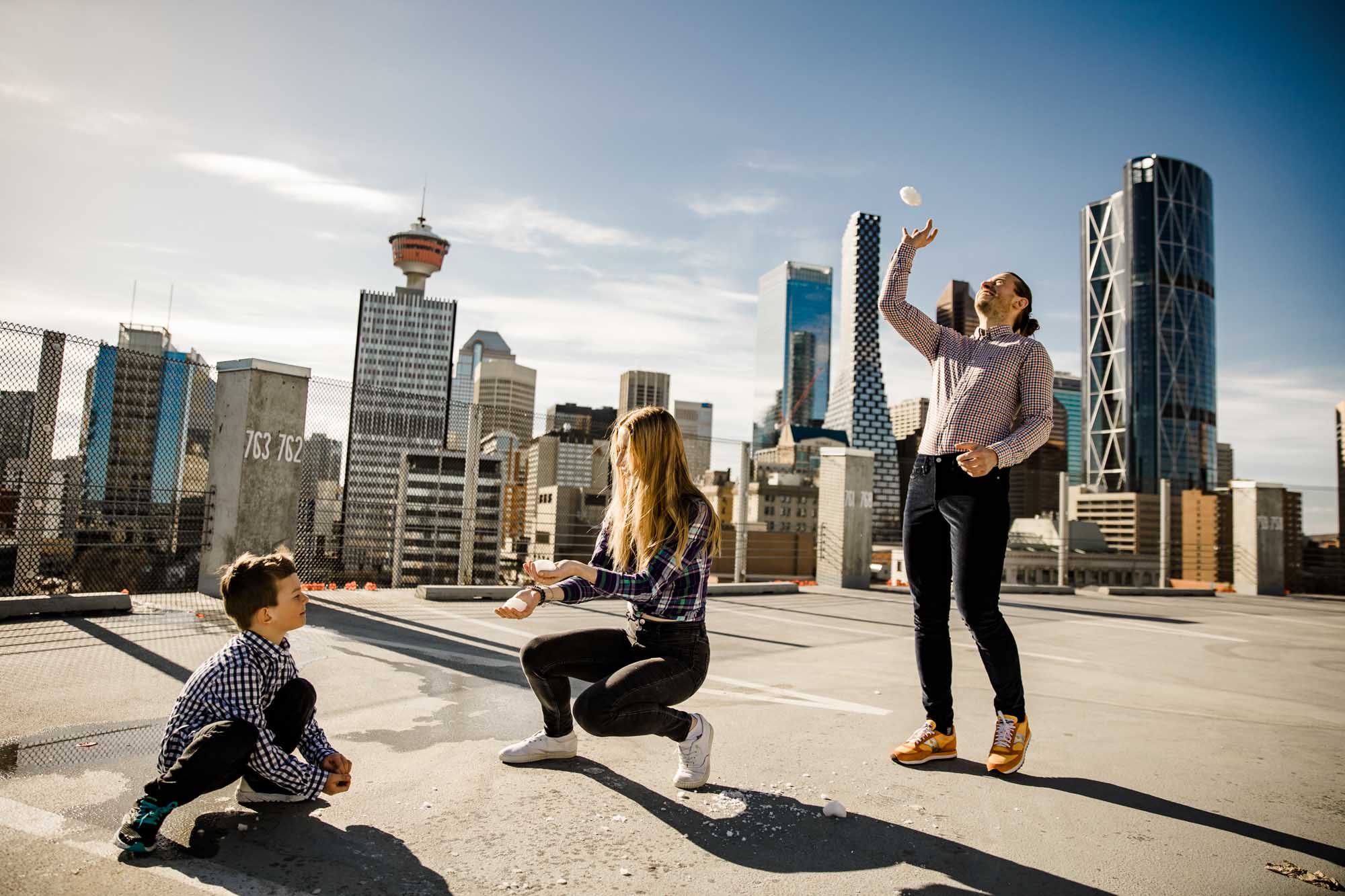 Calgary lifestyle family photograpers, family photo session downtown in the East Village at Platform Innovation Centre in front of the Calgary tower