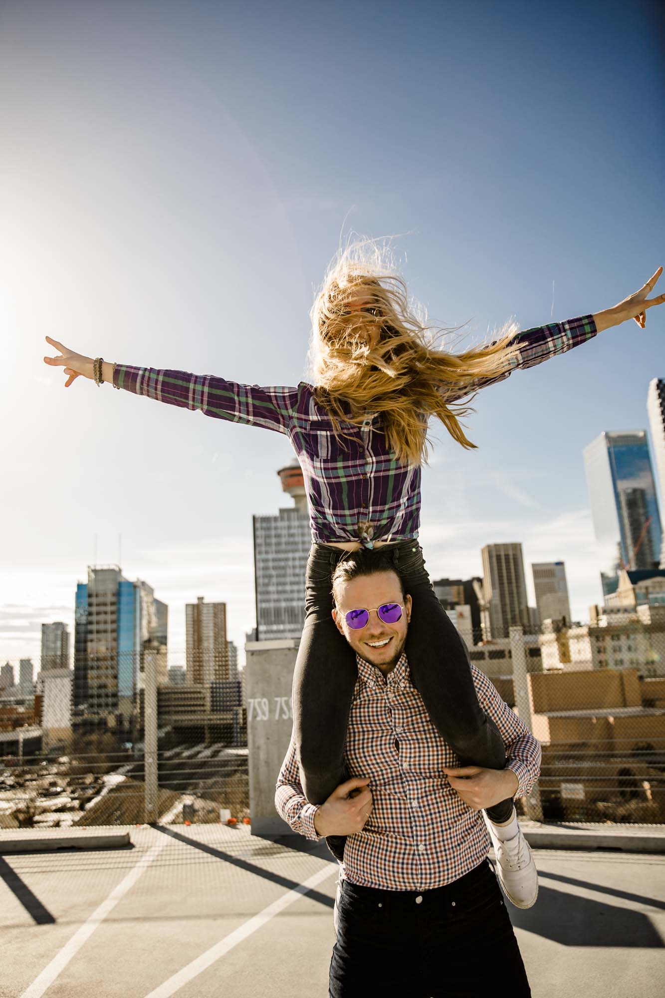 Calgary lifestyle family photograpers, family photo session downtown in the East Village at Platform Innovation Centre in front of the Calgary tower