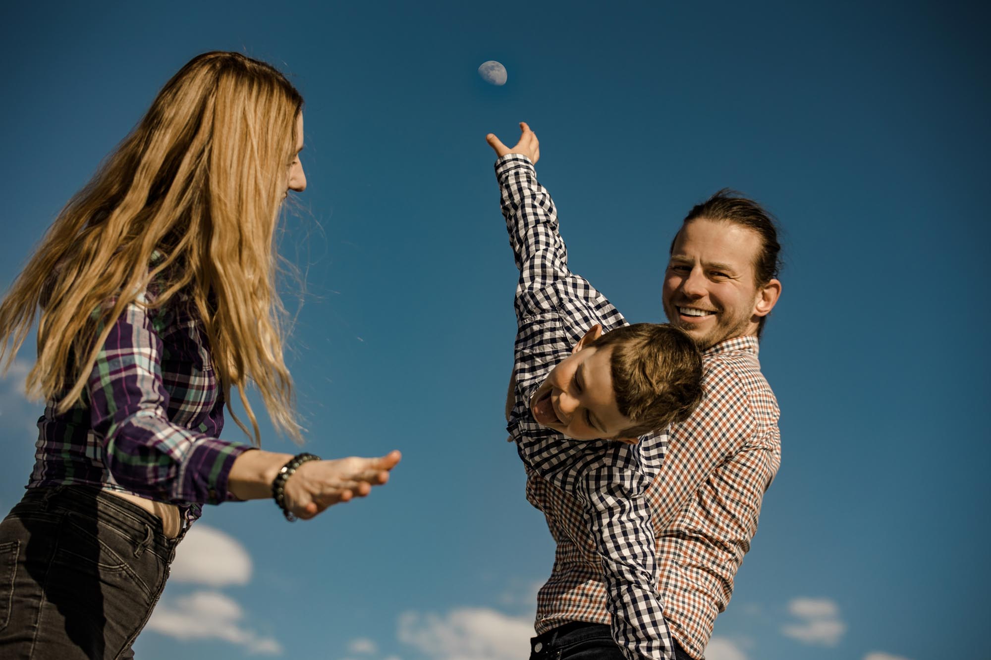 Calgary lifestyle family photograpers, family photo session downtown in the East Village at Platform Innovation Centre in front of the Calgary tower
