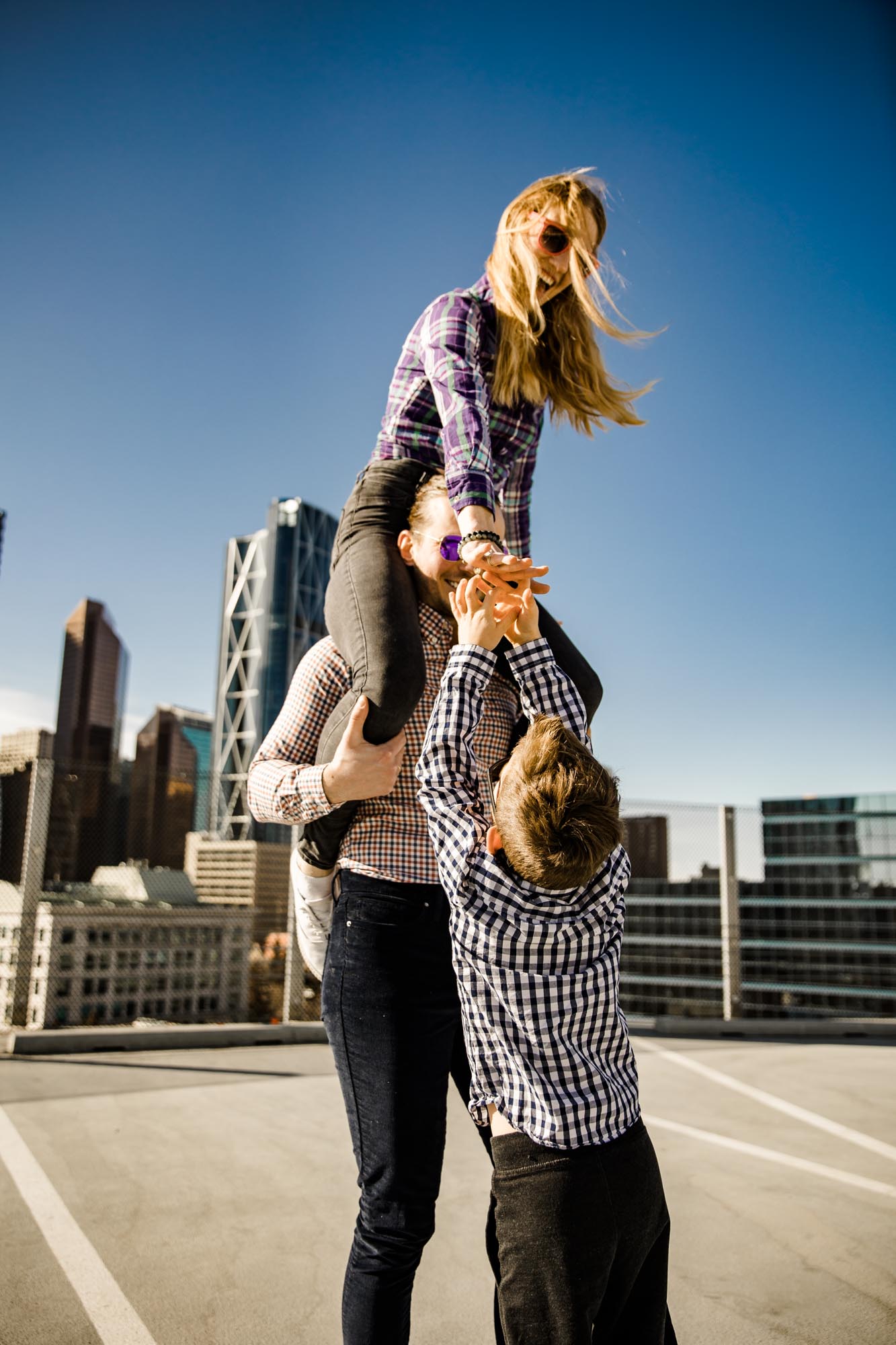 Calgary lifestyle family photograpers, family photo session downtown in the East Village at Platform Innovation Centre in front of the Calgary tower