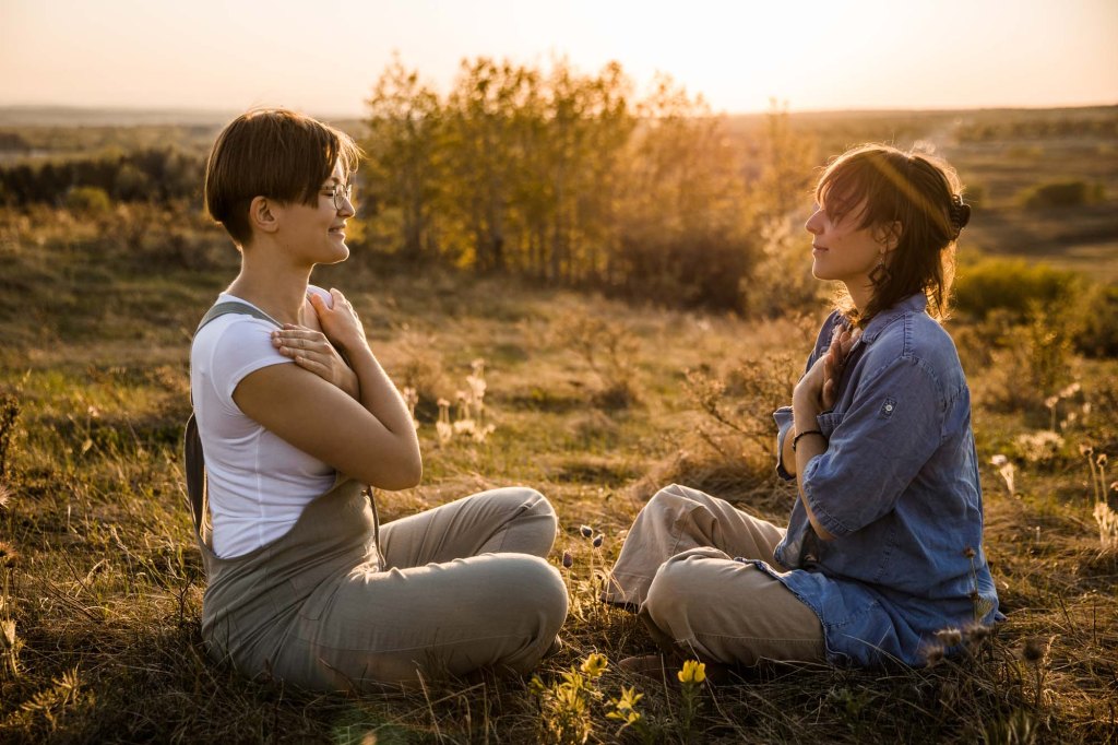 Calgary personal branding photographer, woman business owner posing for her headshot for her branding photos at Nose Hill Park