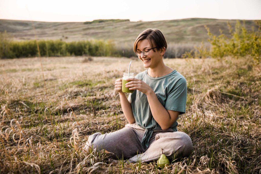 Calgary personal branding photographer, woman business owner posing for her headshot for her branding photos at Nose Hill Park