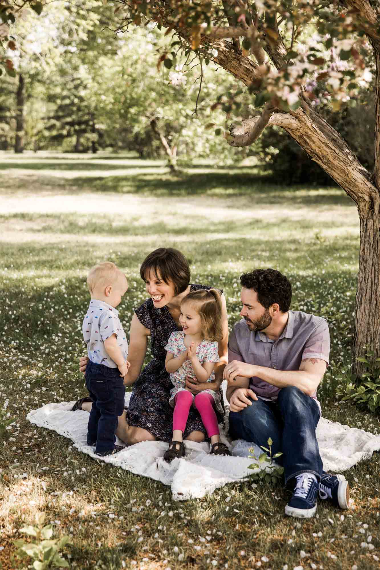 Calgary, Banff and Canmore lifestyle family photographer, family in Baker Park posing for their photos