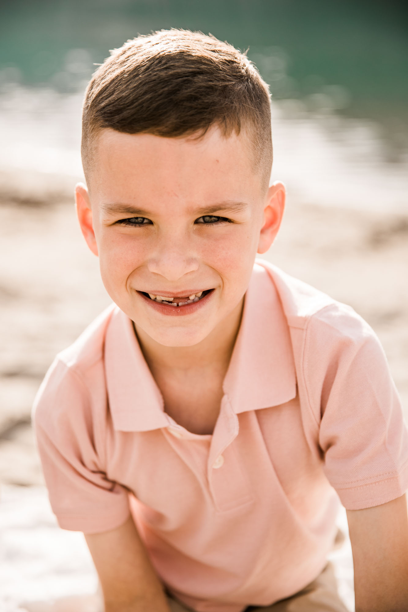 Calgary, Banff, Kananaskis Country lifestyle family photographer, family posing during their beach photoshoot in the mountains in Kananaskis