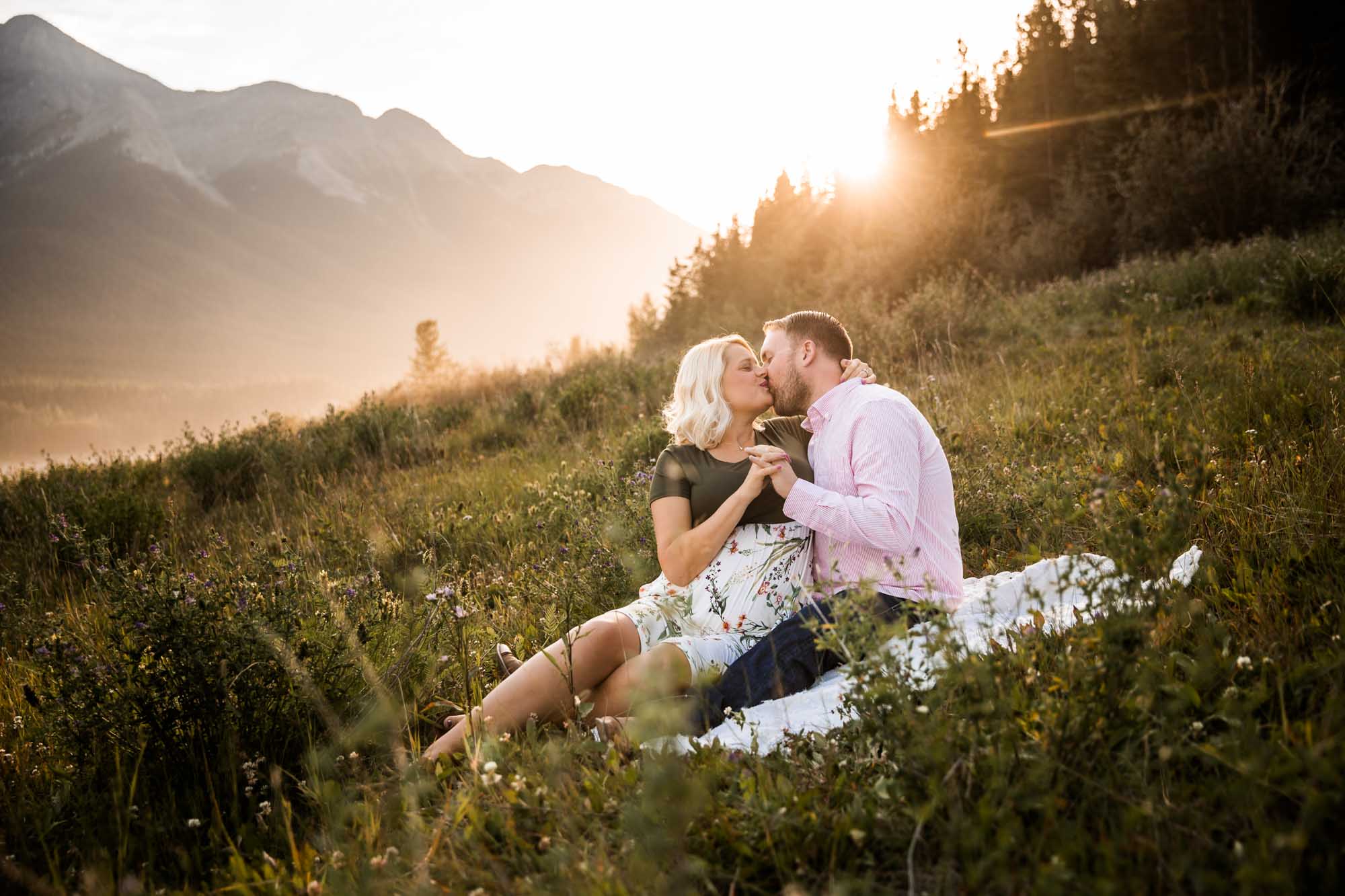 Calgary, Banff, Kananaskis Country lifestyle maternity and newborn photographer, couple posing in the mountains in Kananaskis Country for their maternity photos