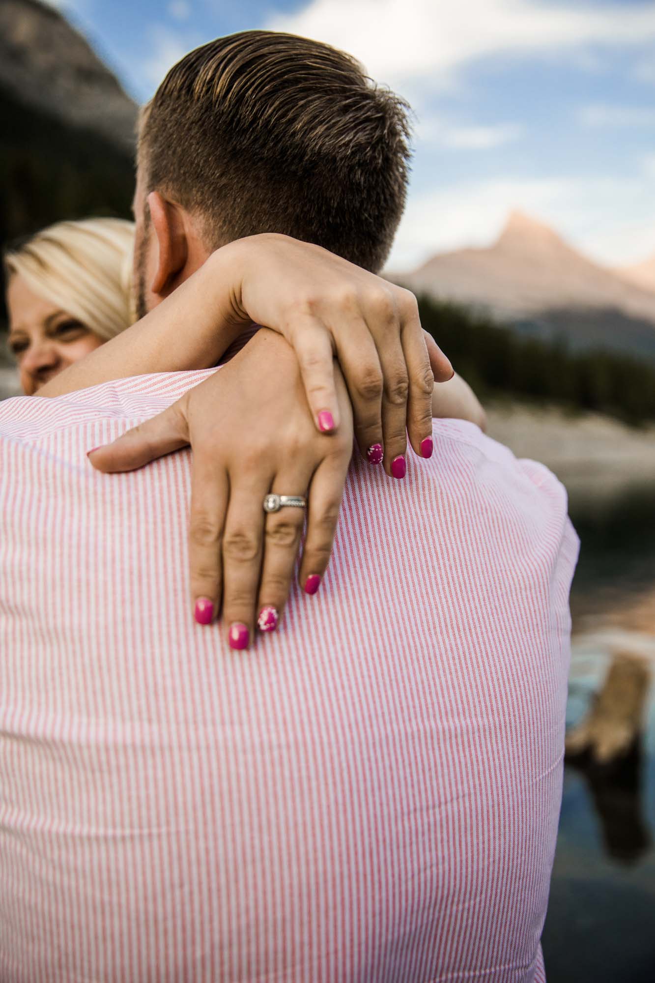 Calgary, Banff, Kananaskis Country lifestyle maternity and newborn photographer, couple posing in the mountains in Kananaskis Country for their maternity photos