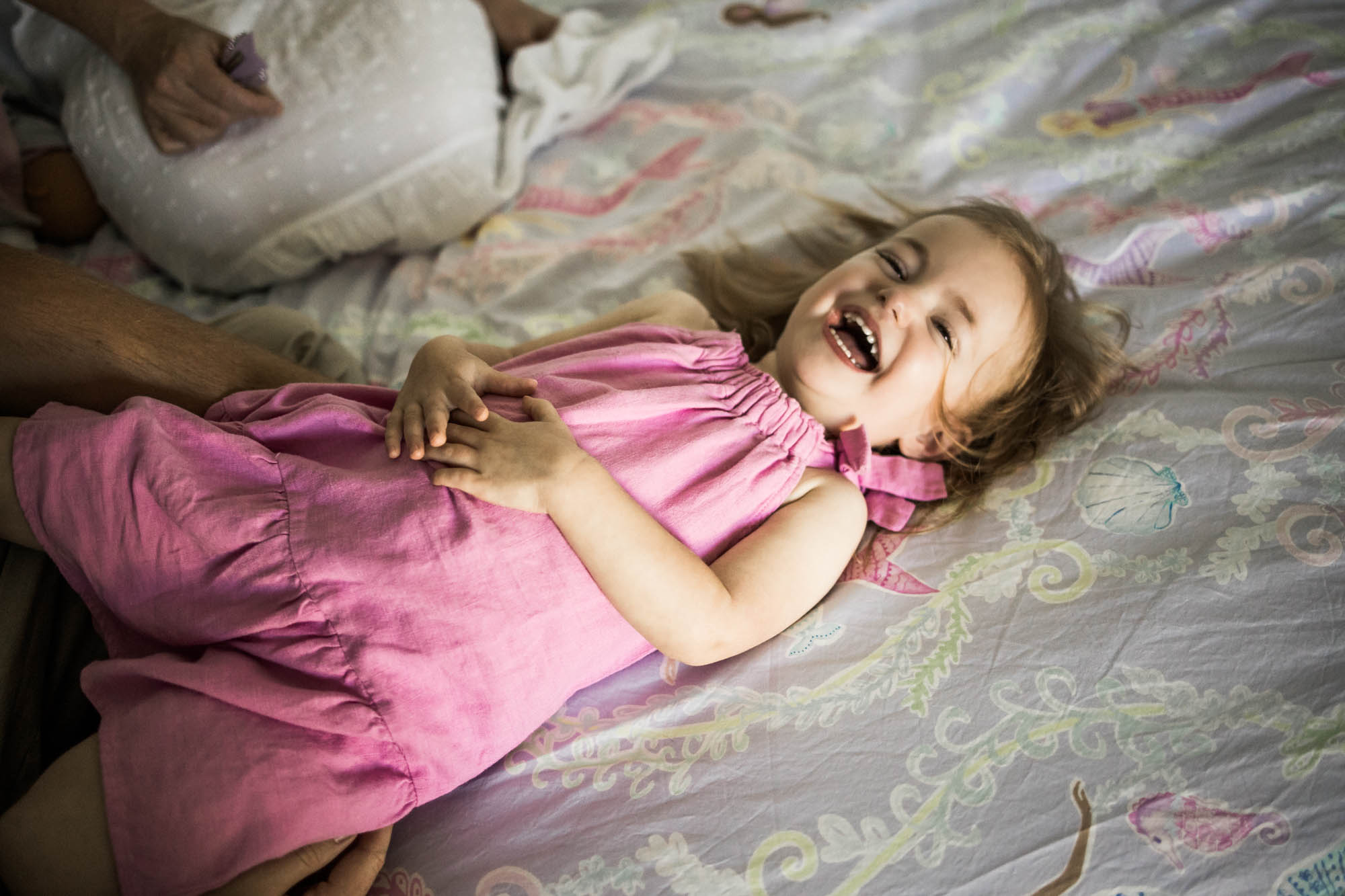 Calgary lifestyle maternity and newborn photographer, family with their newborn baby during their in-home photo session